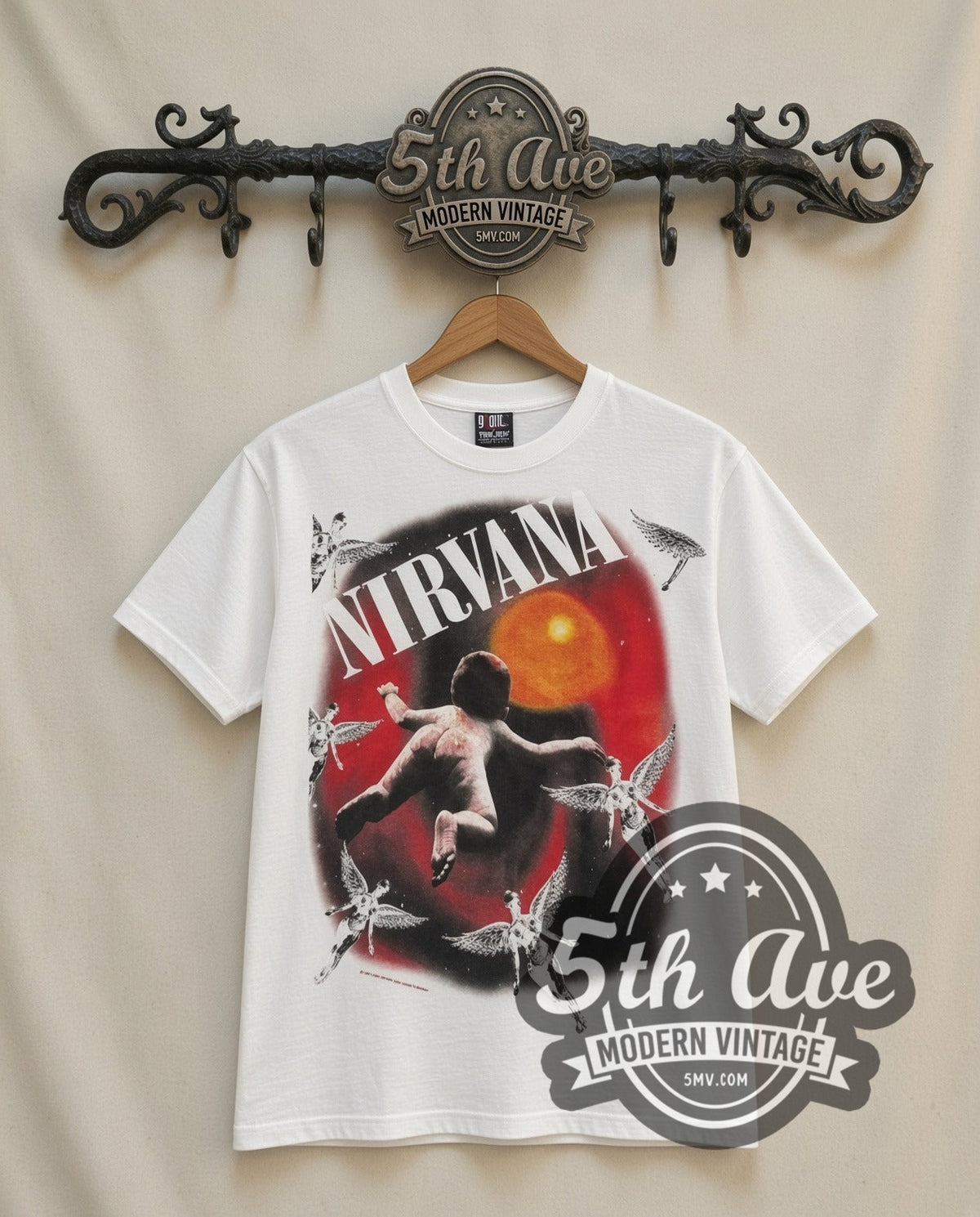 Nirvana Orange Moon vintage band t-shirt in white, front view on a display rack