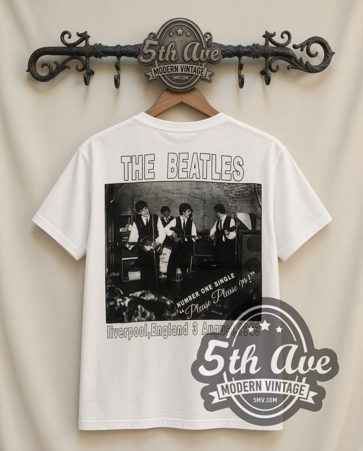 The Beatles Cartoon Band vintage band t-shirt in white, back view on a display rack