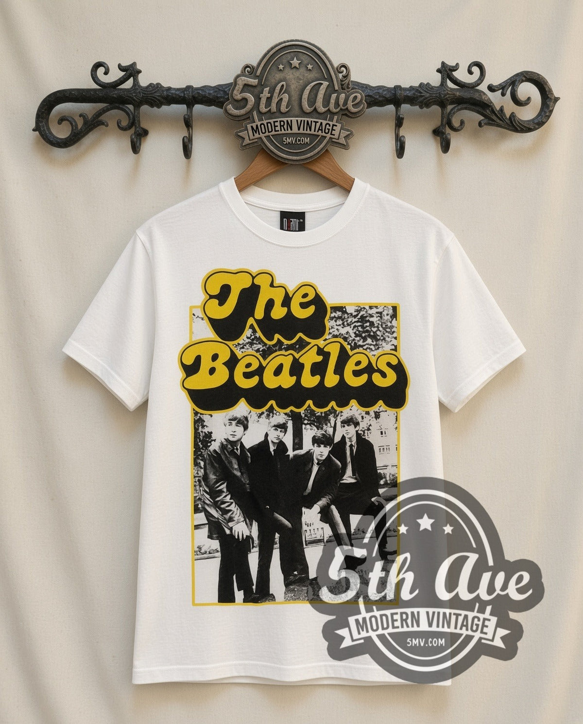 The Beatles Cartoon Band vintage band t-shirt in white, front view on a display rack