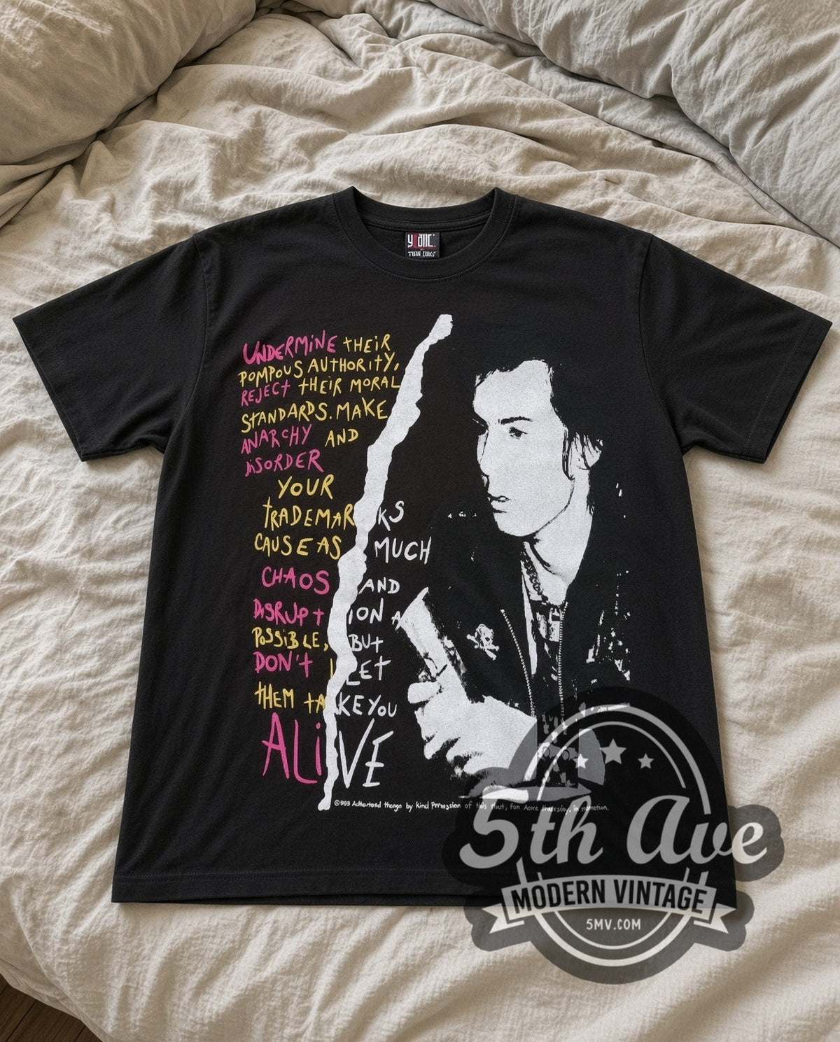 Sid Vicious Your Friends vintage band t-shirt in black laid flat on a bed, front artwork