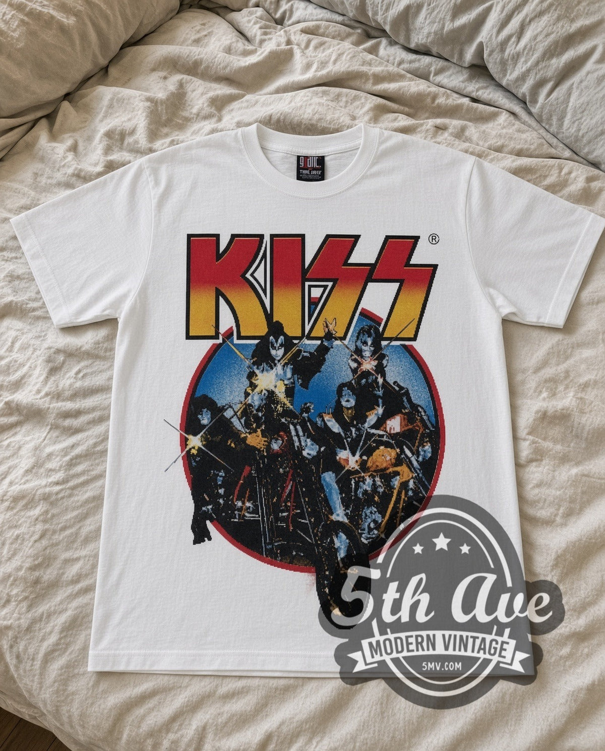KISS Motorcycles vintage band t-shirt in white laid flat on a bed, front artwork