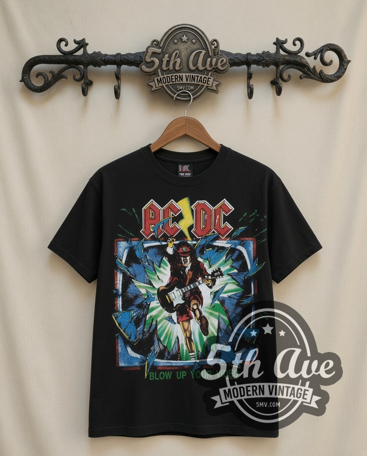 AC/DC Blow Up Your Video vintage band t-shirt in black, front view on a display rack