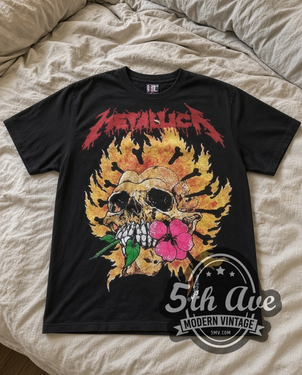 Metallica Flower Skull vintage band t-shirt in black laid flat on a bed, front artwork