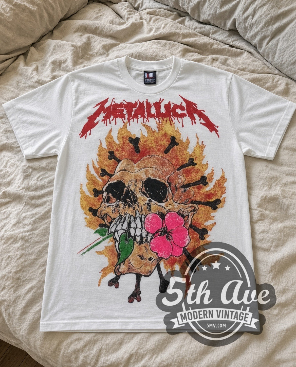 Metallica Flower Skull vintage band t-shirt in white laid flat on a bed, front artwork