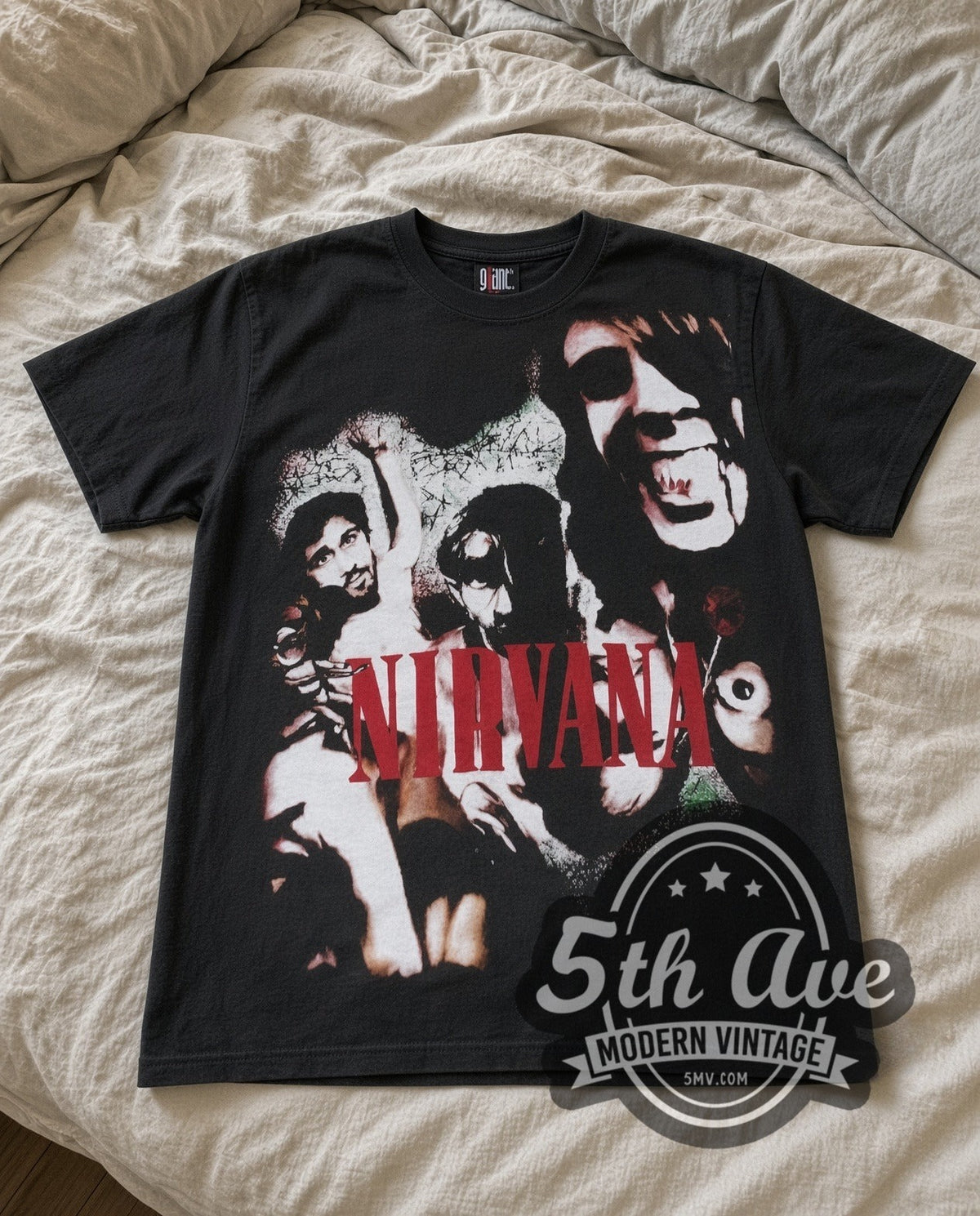Nirvana Red Logo Band vintage band t-shirt in black laid flat on a bed, front artwork