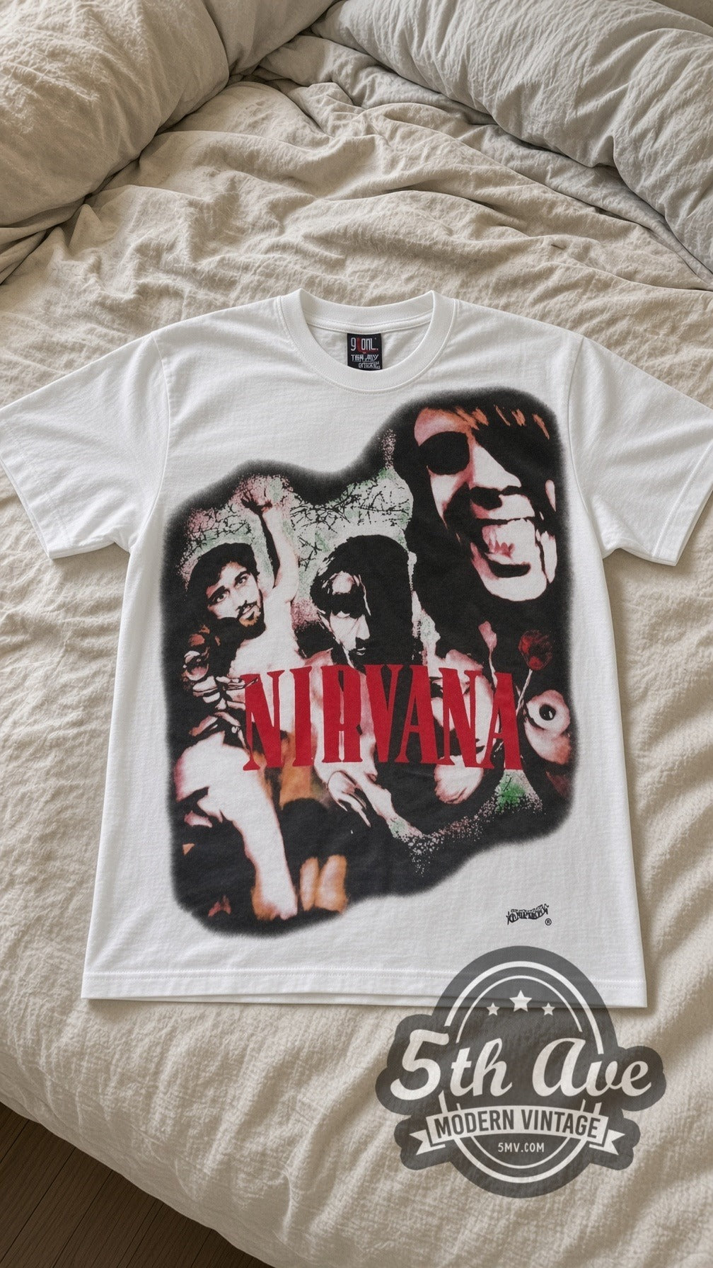 Nirvana Red Logo Band vintage band t-shirt in white laid flat on a bed, front artwork
