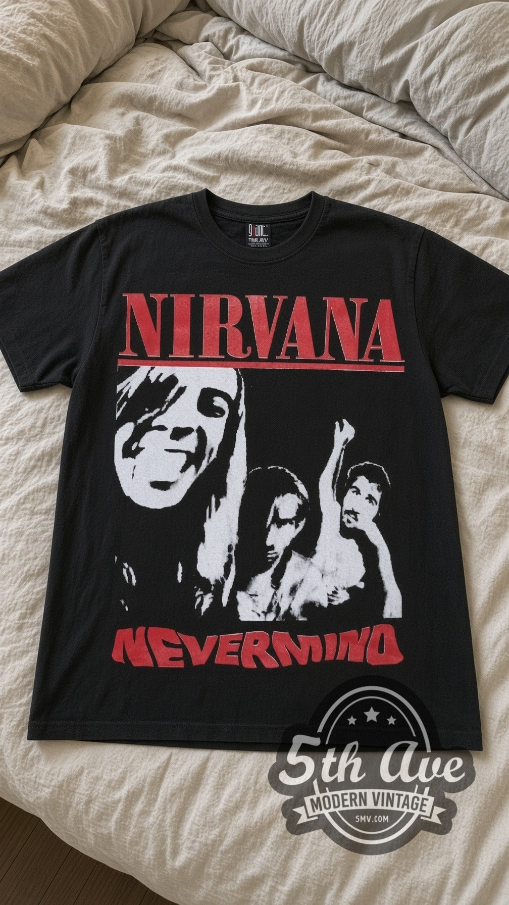 Nirvana Nevermind vintage band t-shirt in black laid flat on a bed, front artwork