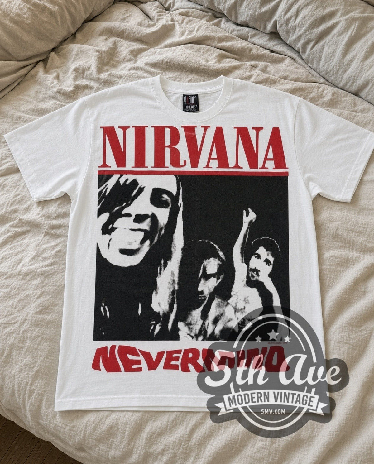 Nirvana Nevermind vintage band t-shirt in white laid flat on a bed, front artwork
