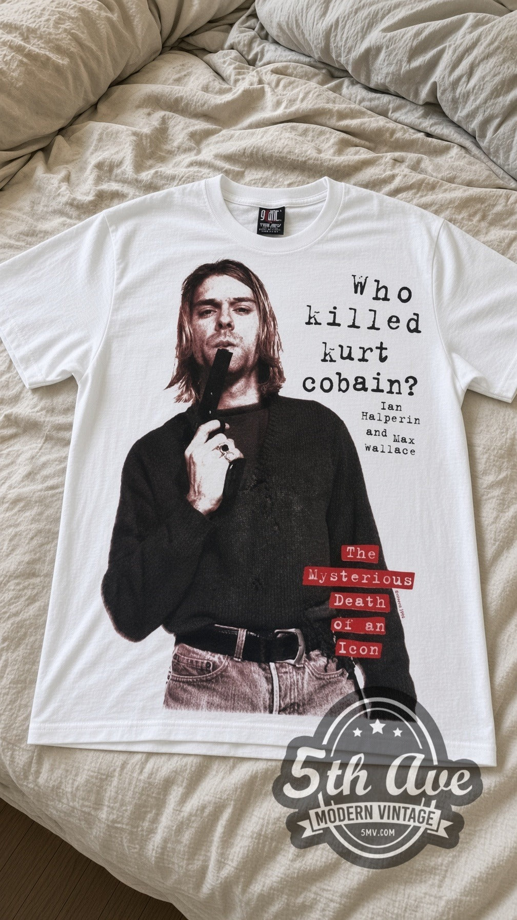 Nirvana Who Killed Kurt vintage band t-shirt in white laid flat on a bed, front artwork