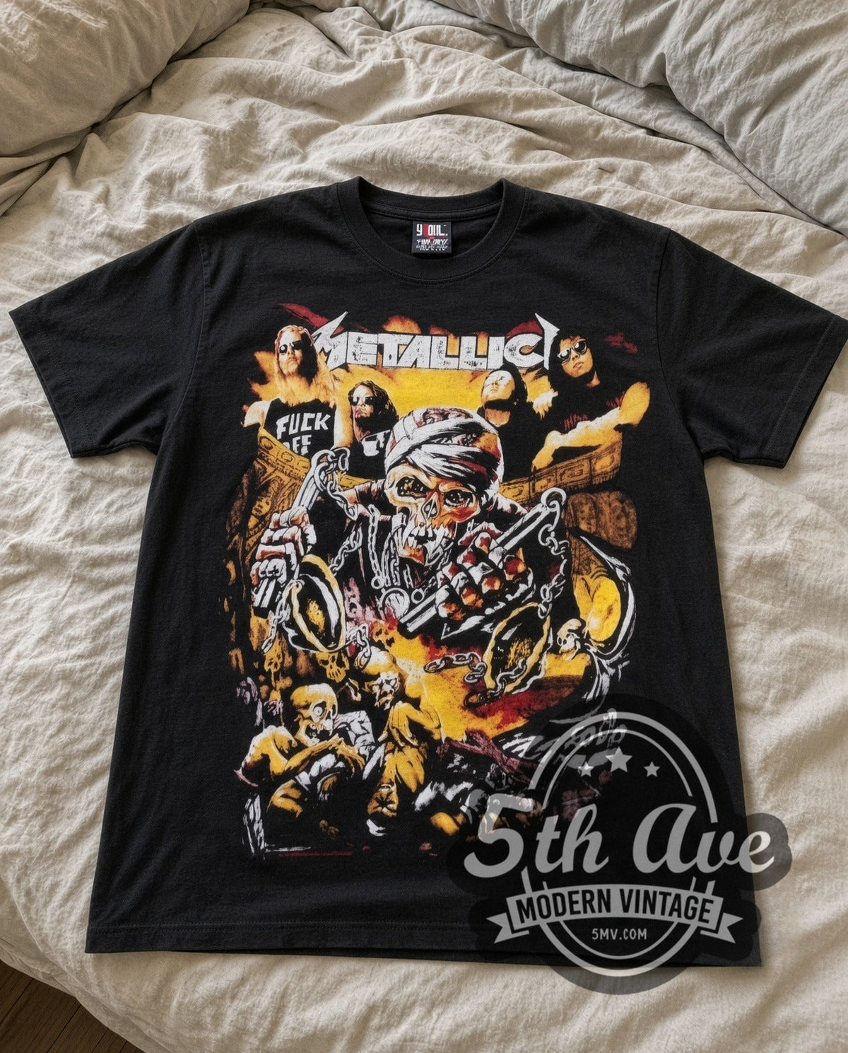Metallica Skull Biker vintage band t-shirt laid flat on a bed, front artwork