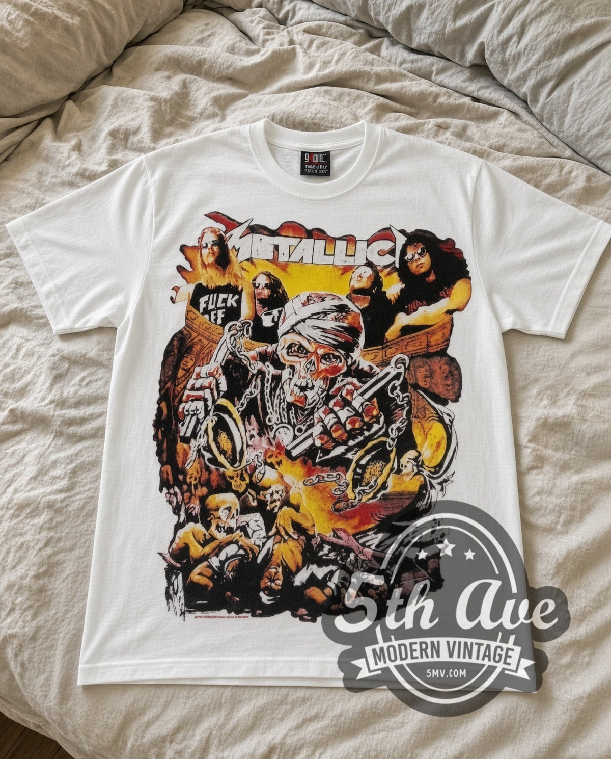 Metallica Biker vintage band t-shirt in white laid flat on a bed, front artwork