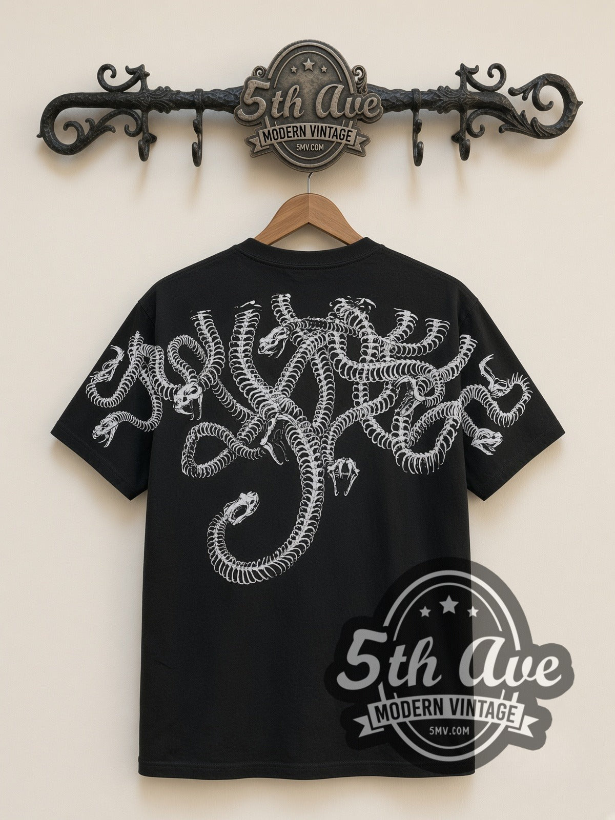 Medusa Snake Skull all-over-print vintage graphic tee in black, back view on a display rack