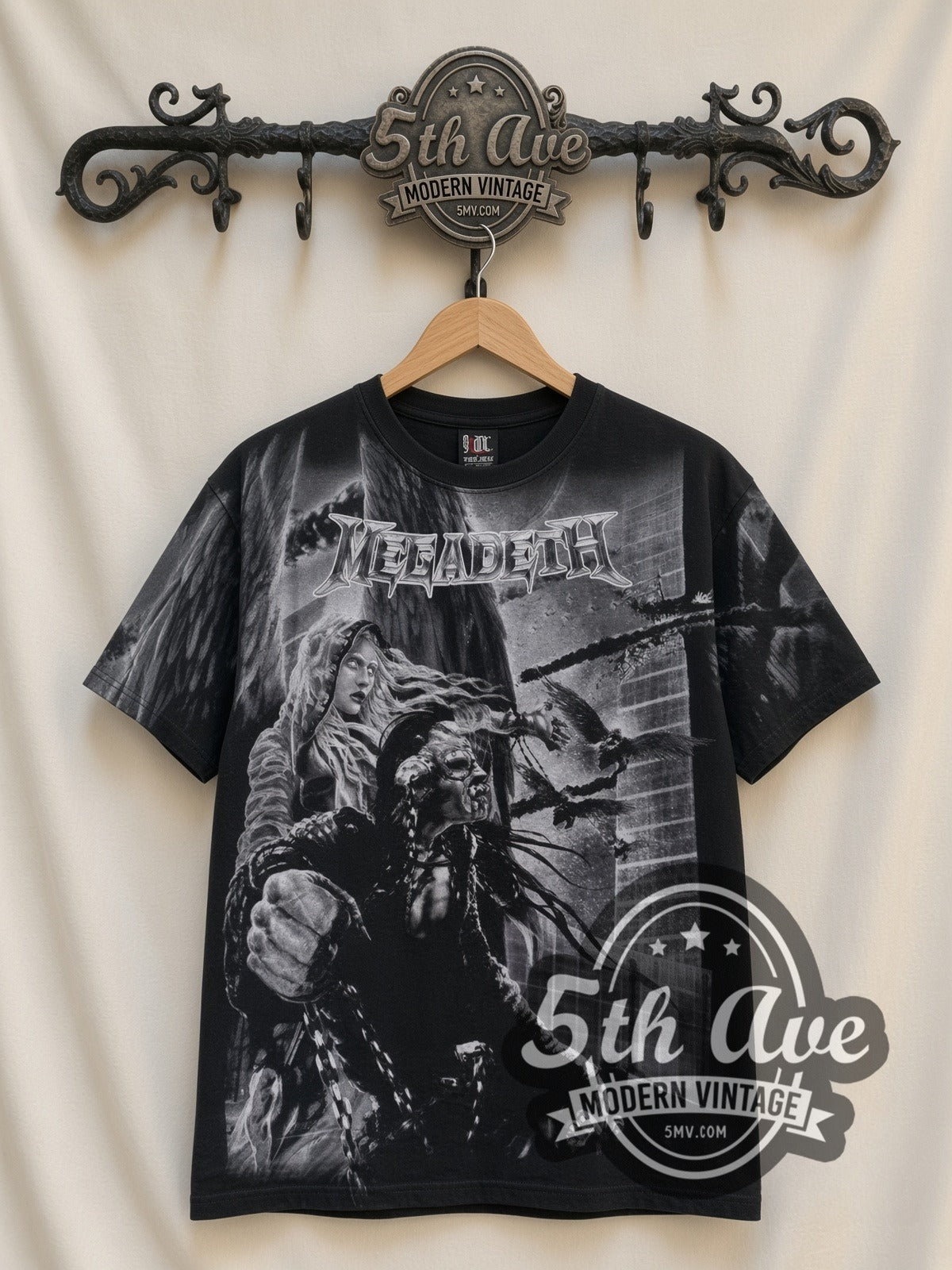 Megadeth Apocalyptic City all-over-print vintage band t-shirt in black, front view on a display rack