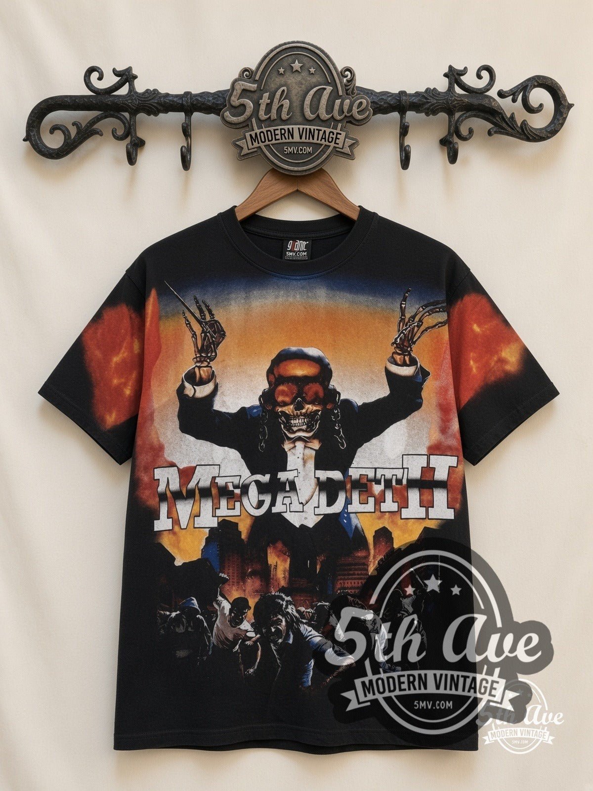 Megadeth Vic Flames Arms Raised all-over-print vintage band t-shirt in black, front view on a display rack
