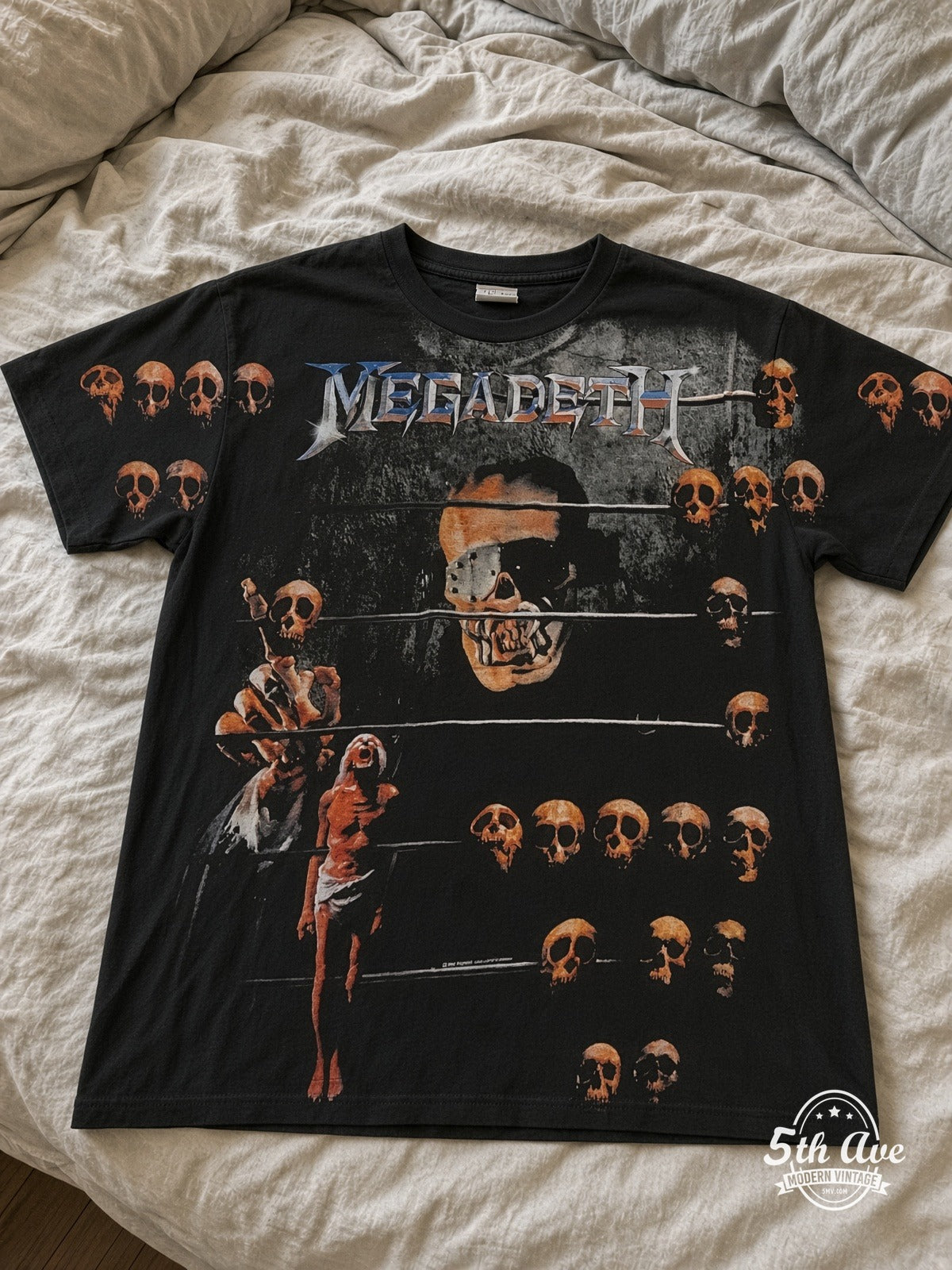 Megadeth Vic Prison Bars Skulls all over print vintage tee laid on bed