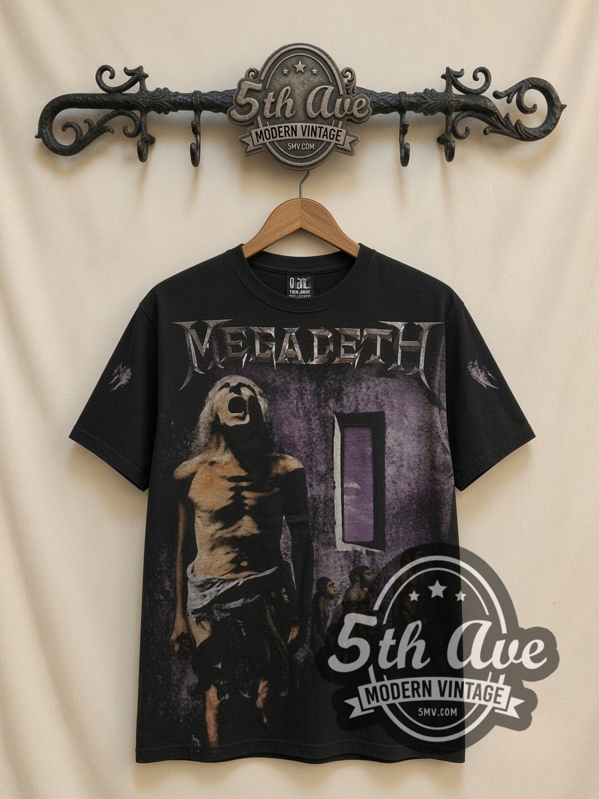 Megadeth Youthanasia all-over-print vintage band t-shirt in black, front view on a display rack