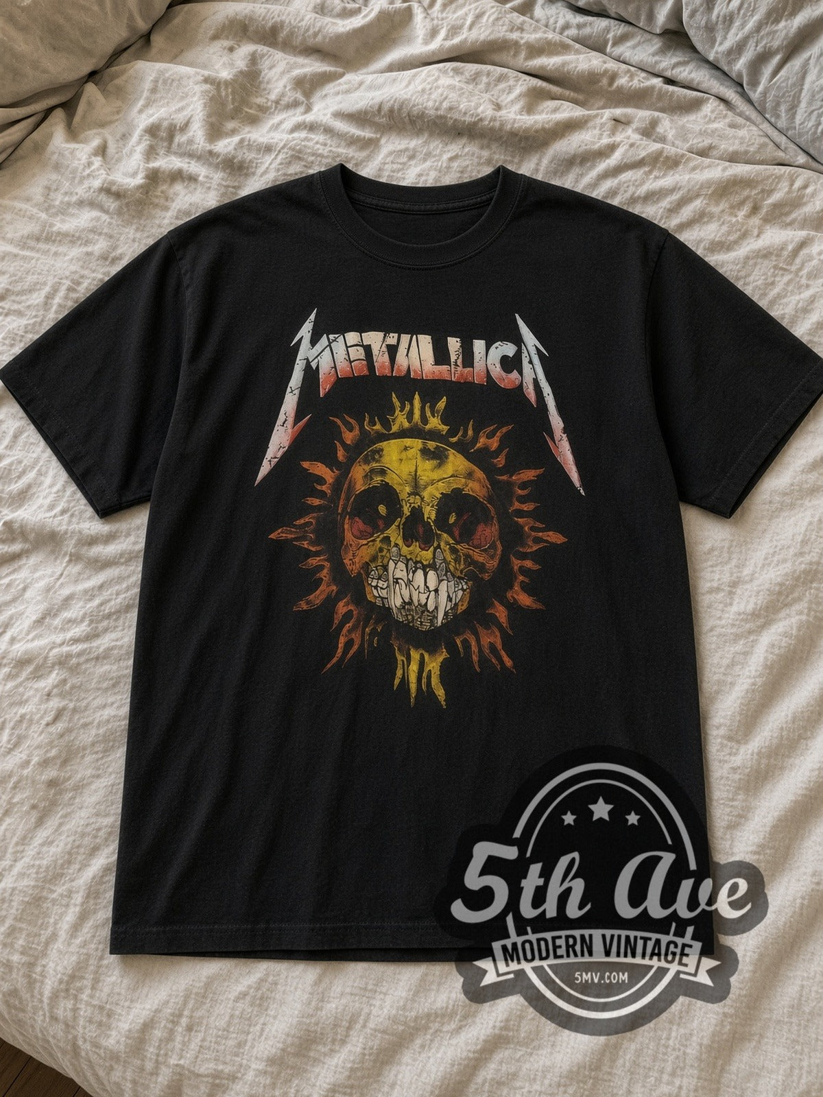 Black Metallica Skull Sun with Flaming Skull Back Vintage Band T-Shirt laid flat on a linen bed