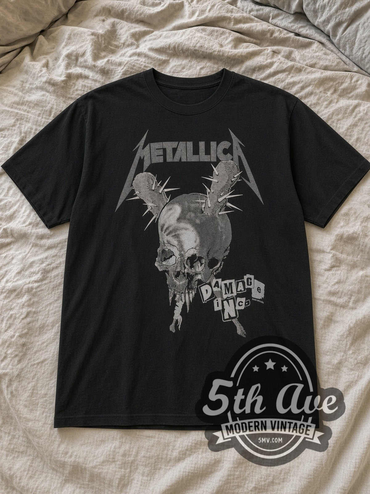 Black Metallica Damage Inc. Red Crown Pushead Skull Vintage Band T-Shirt laid flat on a linen bed