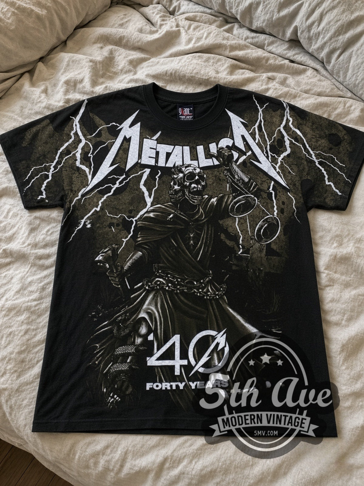 Metallica 40 Years Lady Justice all-over-print vintage band tee in black laid flat