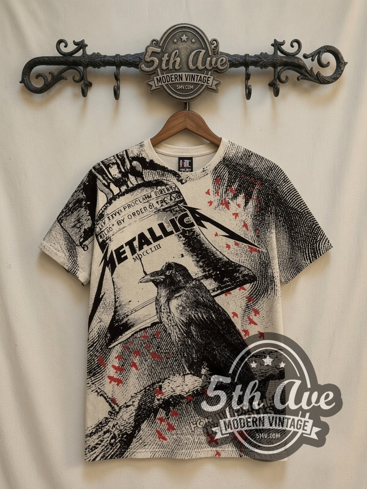 Metallica For Whom the Bell Tolls Crow all-over-print vintage band t-shirt, front view on a display rack