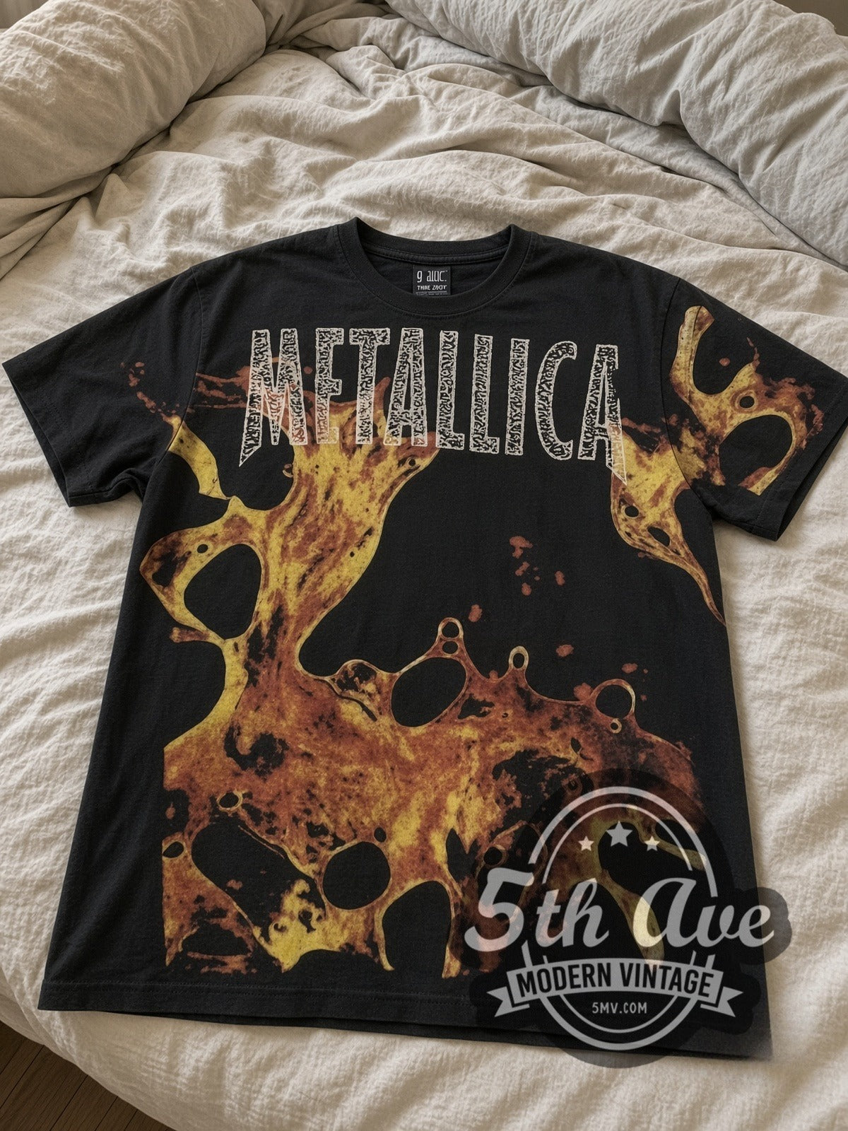 Metallica Liquid Fire all-over-print vintage band tee laid flat