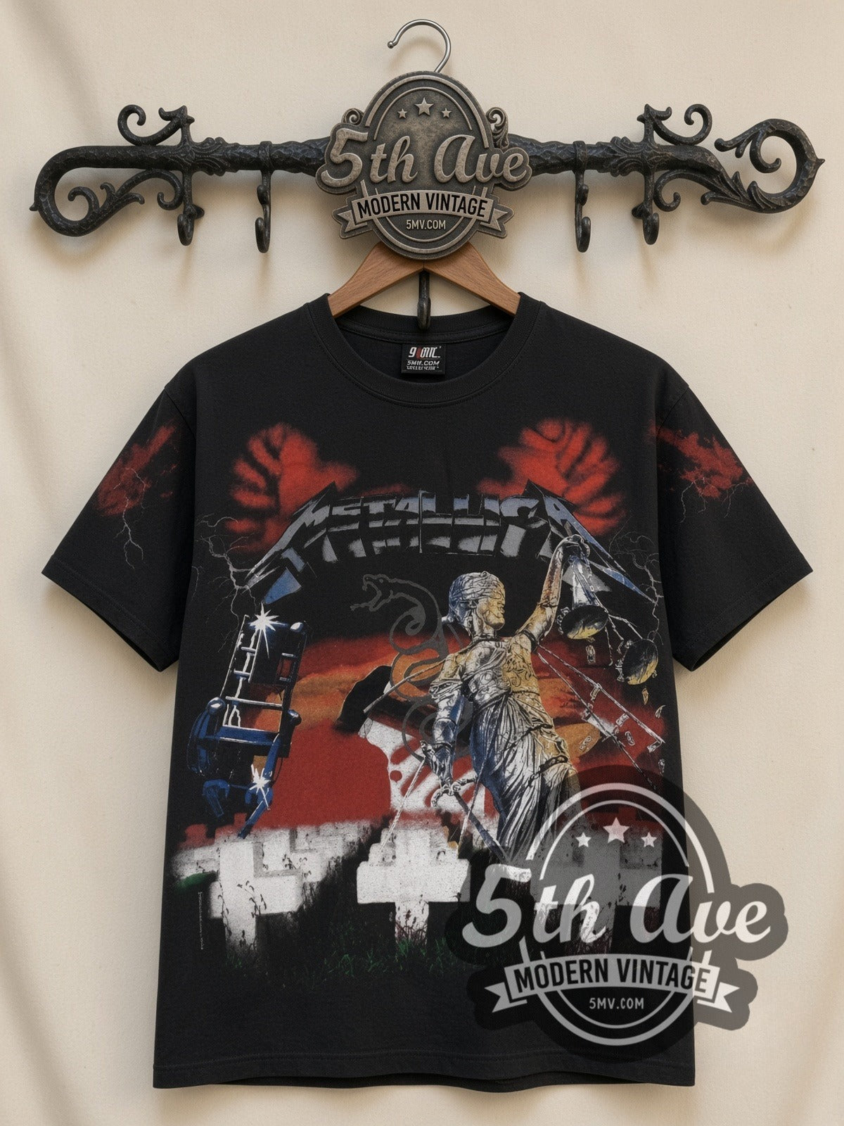 Metallica Master of Puppets Graveyard all-over-print vintage band t-shirt in black, front view on a display rack