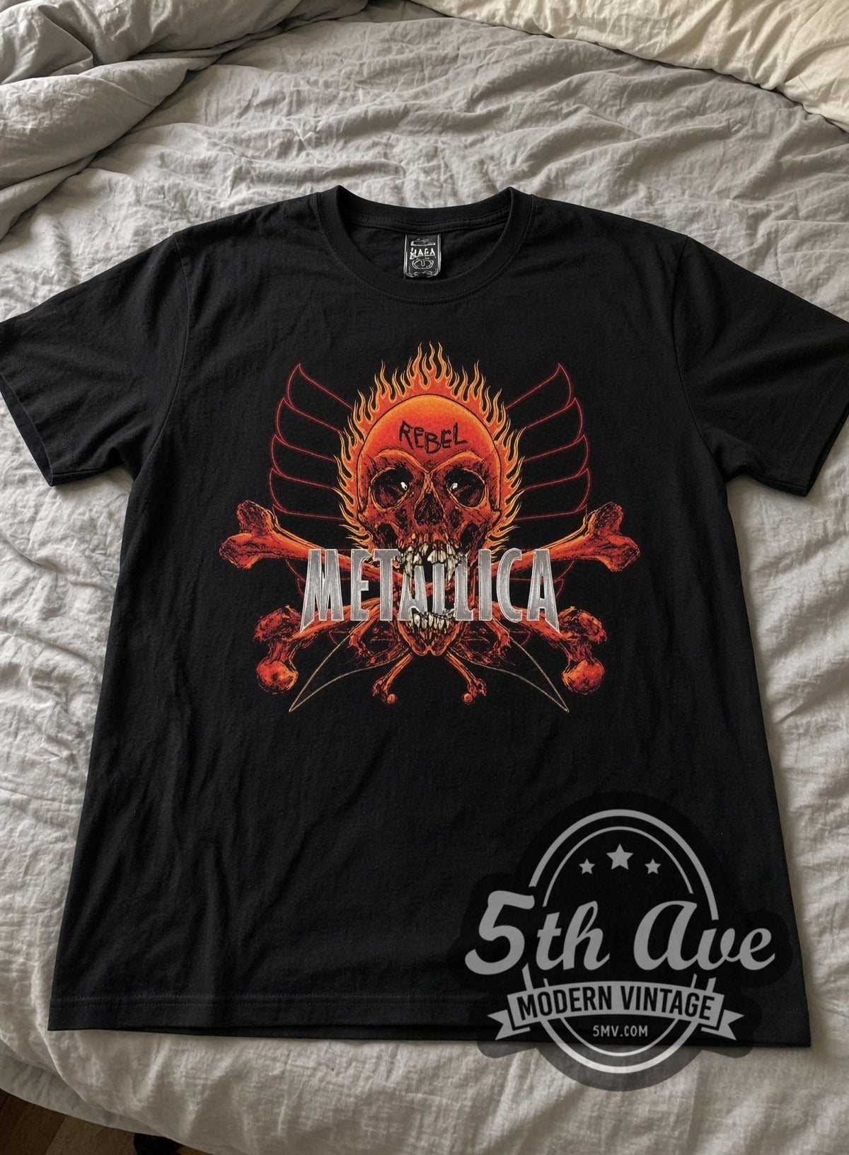 Metallica Rebel Flaming Skull vintage band tee laid flat