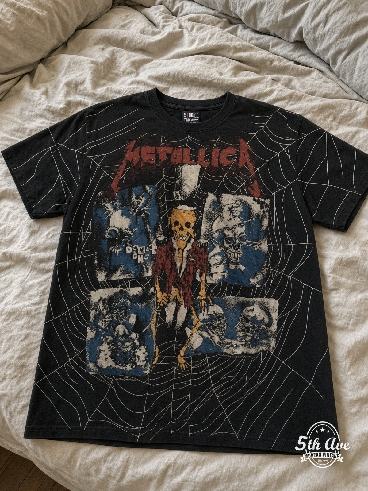 Metallica Skeleton Spiderweb all over print vintage tee laid on bed