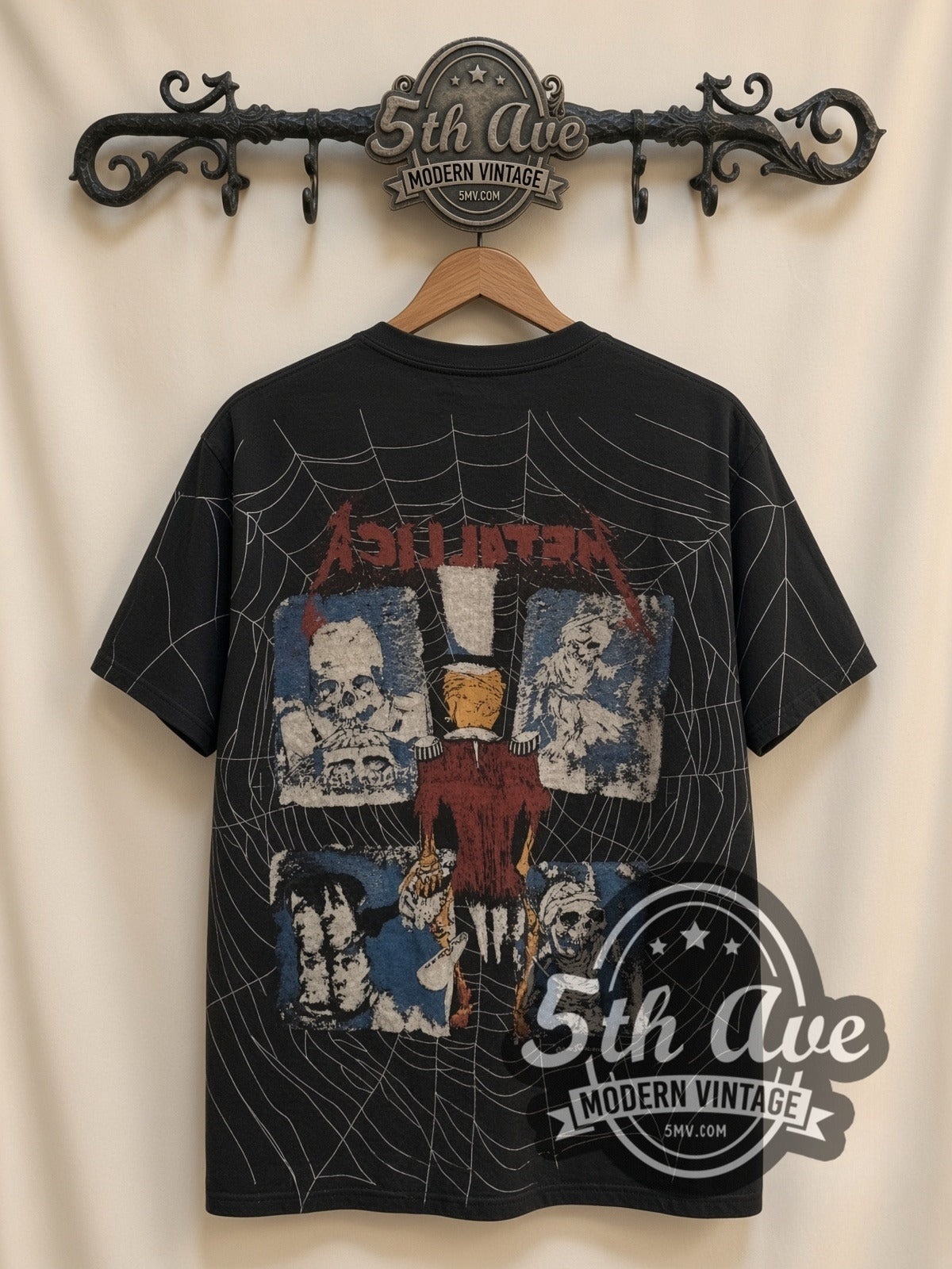Metallica Skeleton Spiderweb all-over-print vintage band t-shirt in black, back view on a display rack