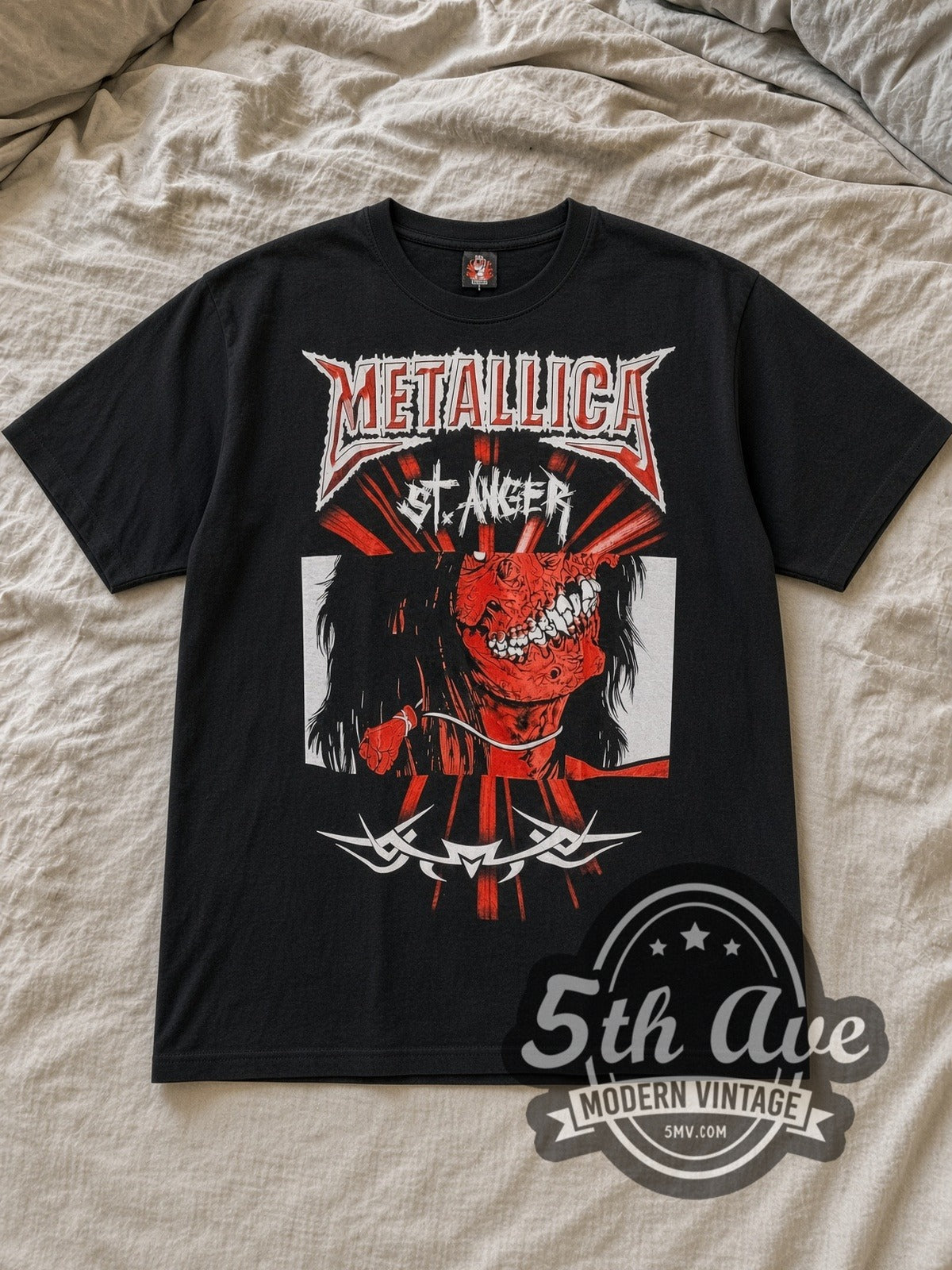 Black Metallica St. Anger Vintage Band T-Shirt laid flat on a linen bed