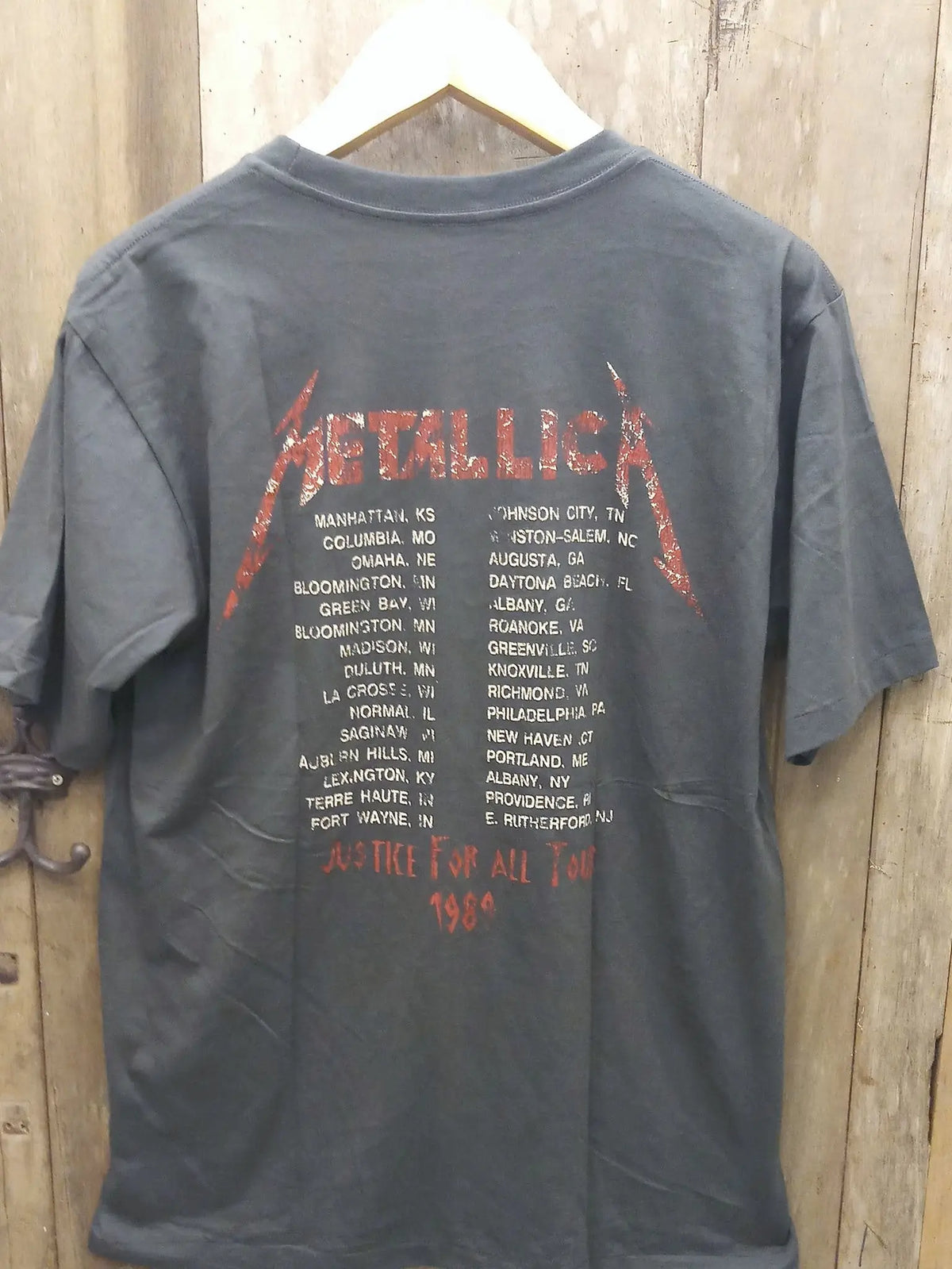 Metallica '...And Justice for All' Tour 1989 Lady with Scales Cotton T-Shirt vintage t-shirt laid on bed