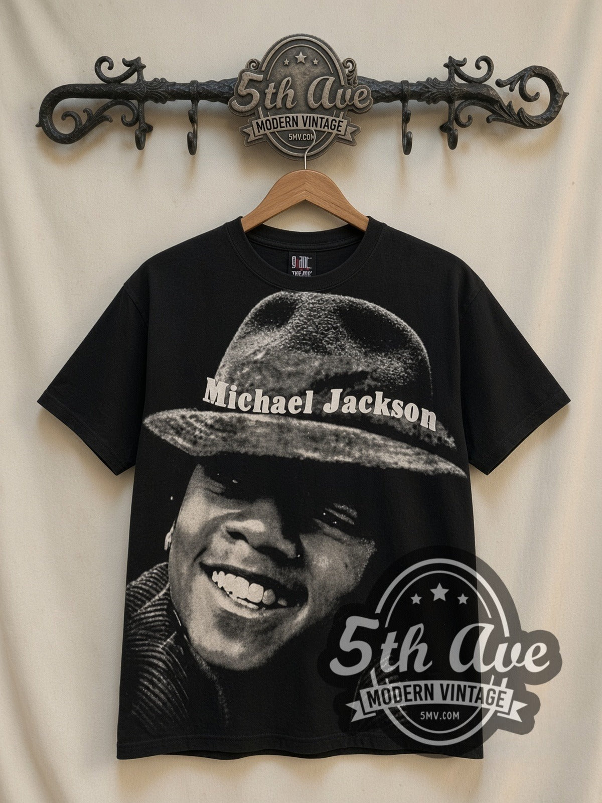 Michael Jackson Hat Portrait all-over-print graphic tee in black, front view on a display rack