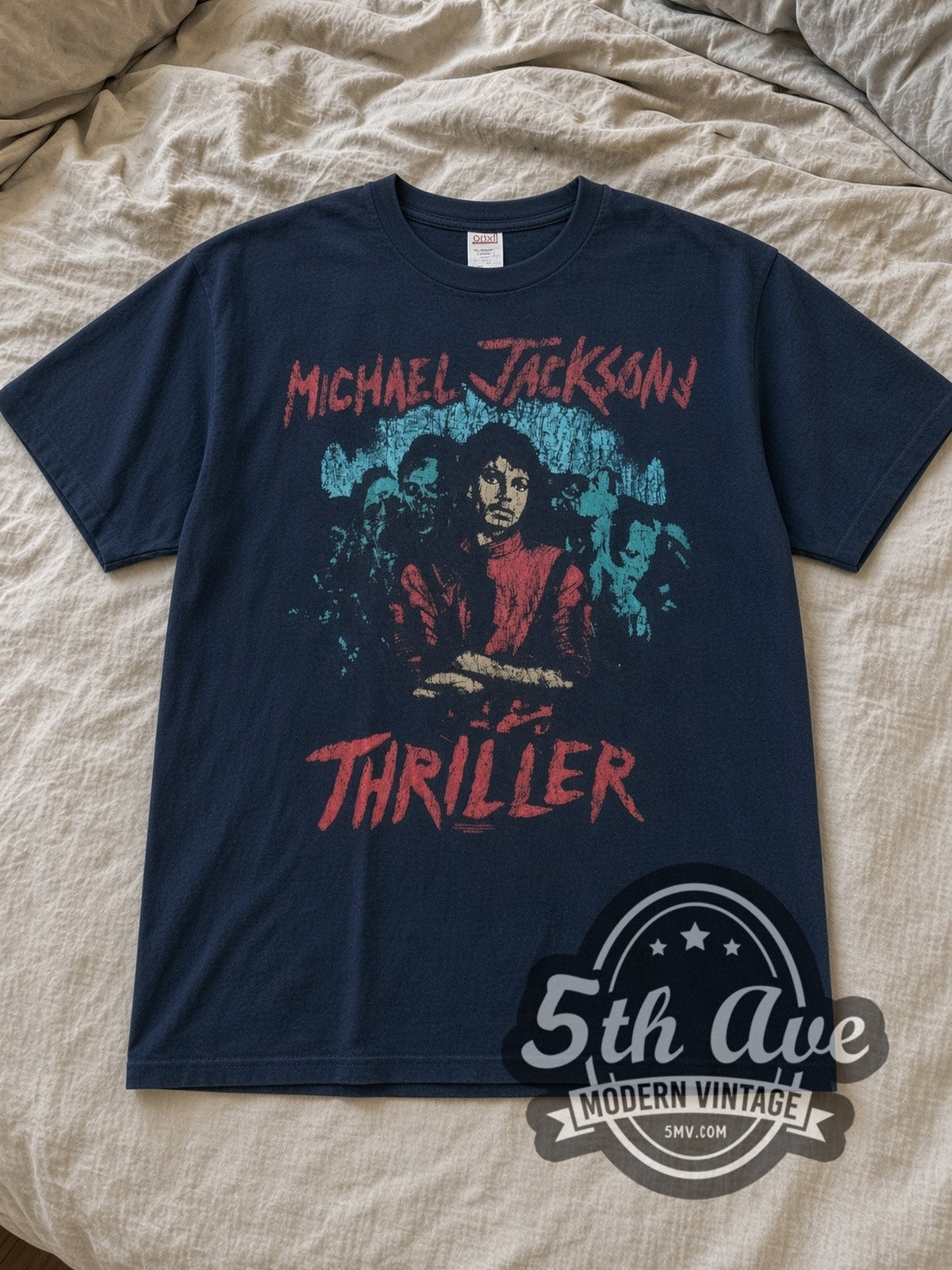 Navy Michael Jackson Thriller Vintage Band T-Shirt laid flat on a linen bed