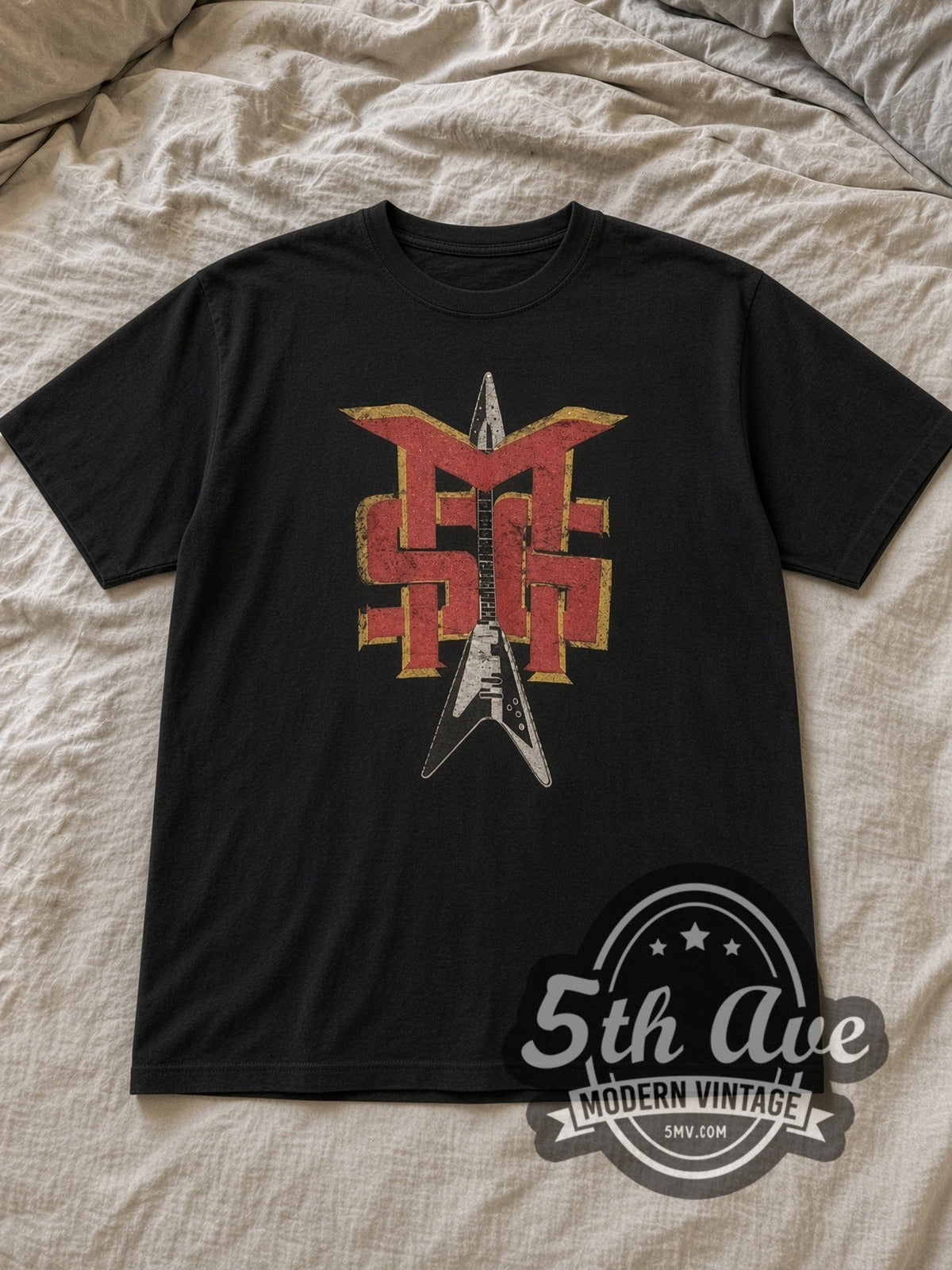 Black Michael Schenker Group Guitar Logo Vintage Band T-Shirt laid flat on a linen bed