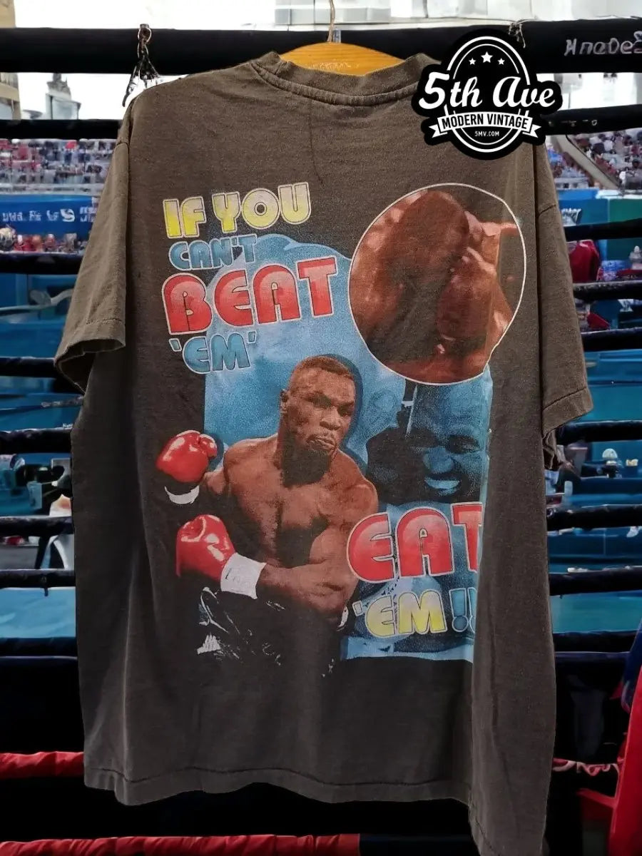 Mike Tyson "If You Can't Beat 'Em, Eat 'Em" Single Stitch Beauty T-Shirt vintage t-shirt laid on bed