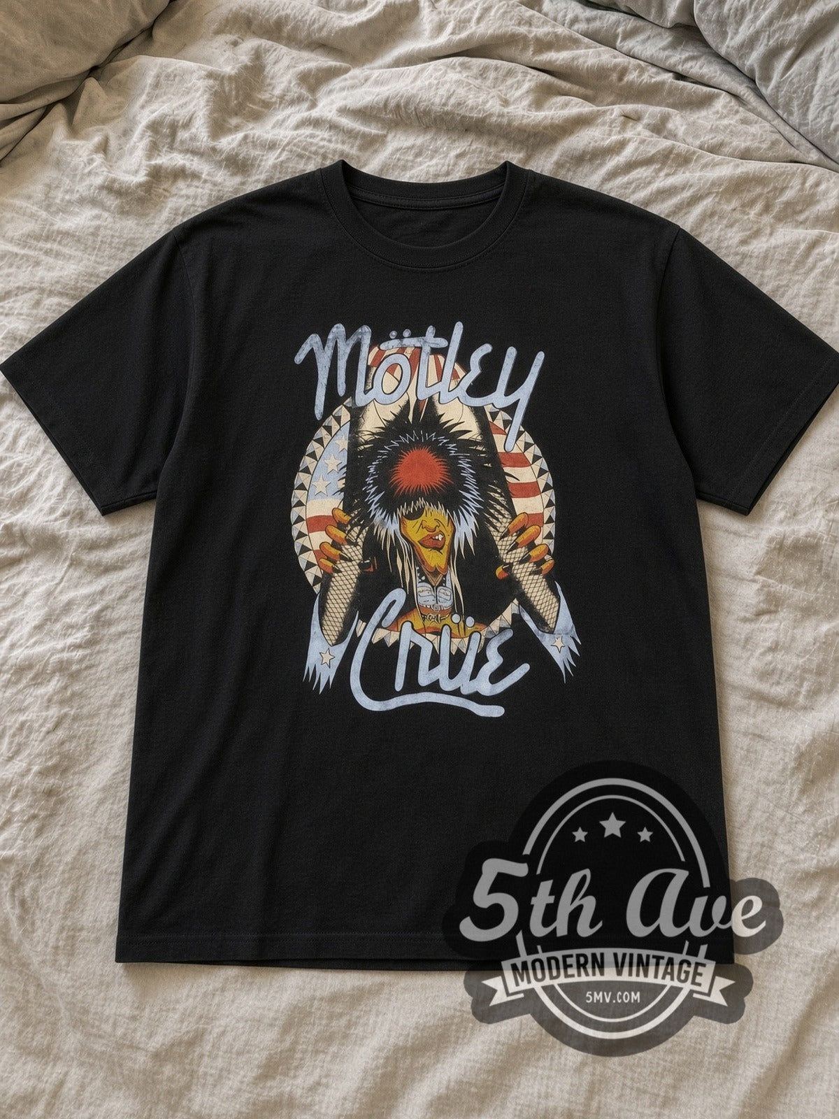 Black Mötley Crüe Nikki Sixx American Flag Breakthrough Vintage Band T-Shirt laid flat on a linen bed