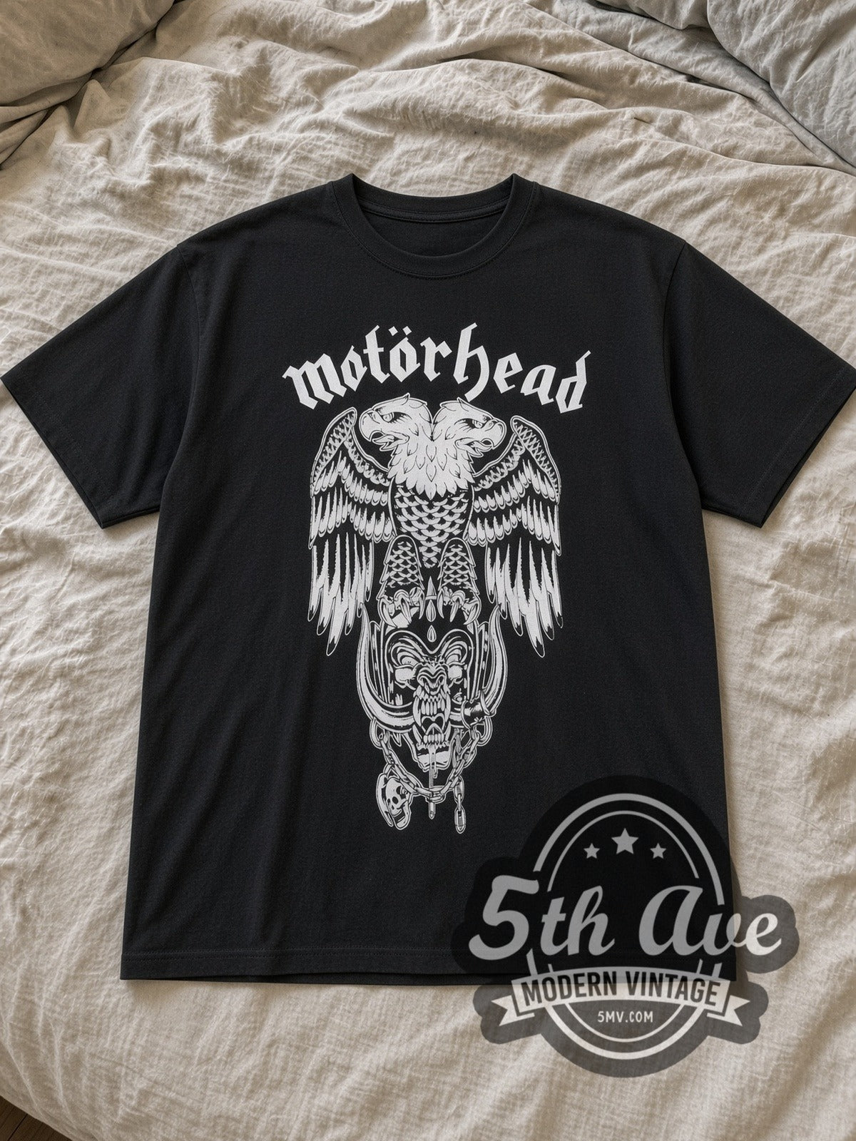 Black Motörhead Two Headed Eagle Snaggletooth Vintage Band T-Shirt laid flat on a linen bed