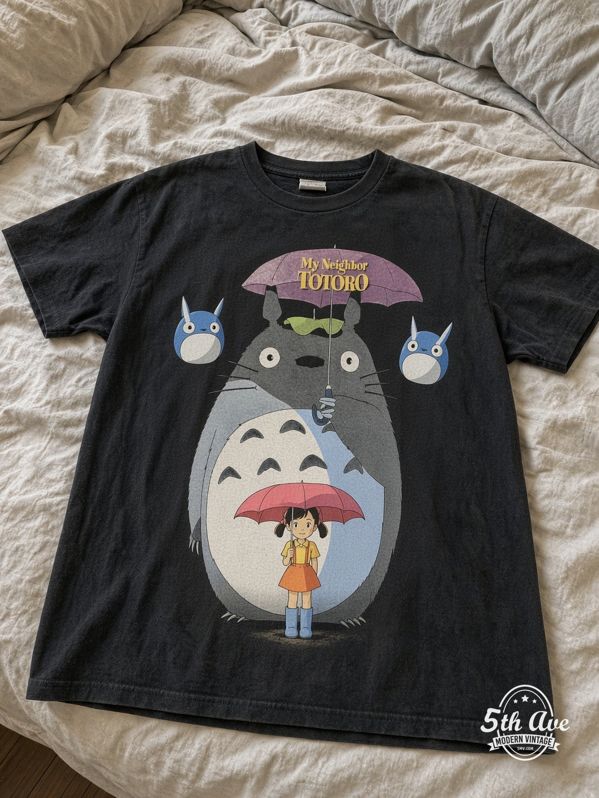 My Neighbor Totoro Bus Stop vintage tee laid on bed