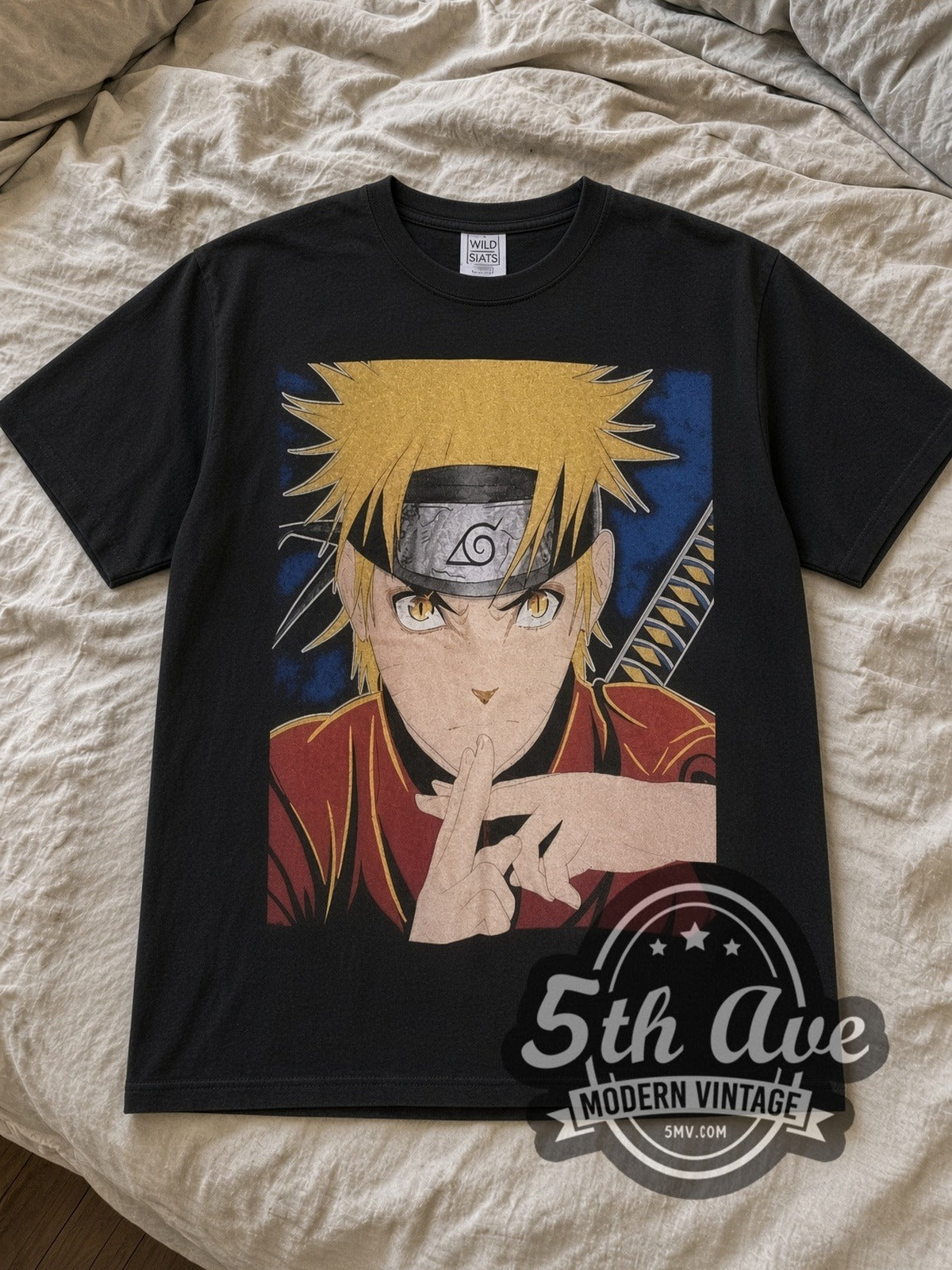 Black Naruto Shippuden All Over Print Vintage Anime T-Shirt laid flat on a linen bed