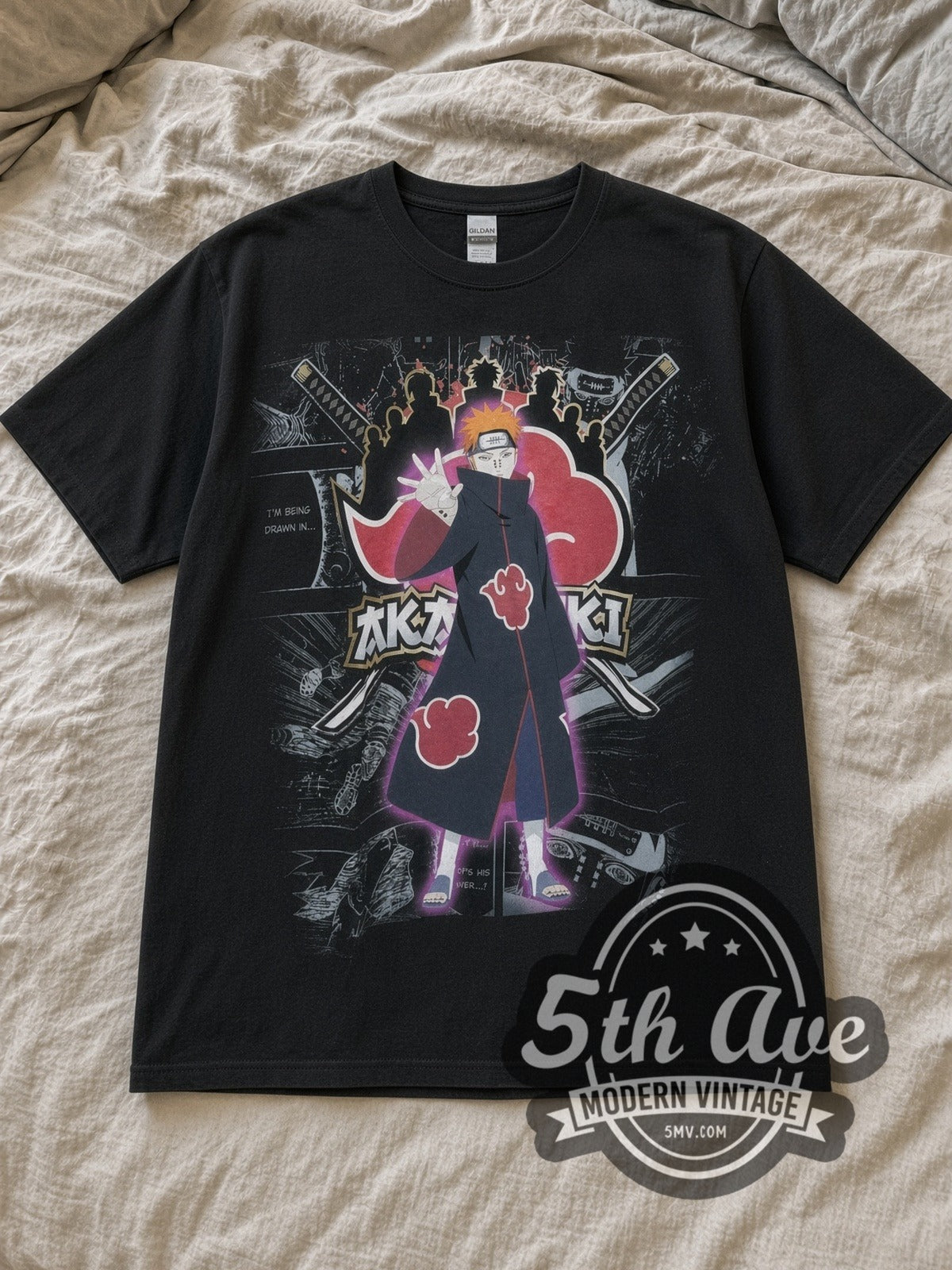 Black Naruto Shippuden Akatsuki Vintage Anime T-Shirt laid flat on a linen bed