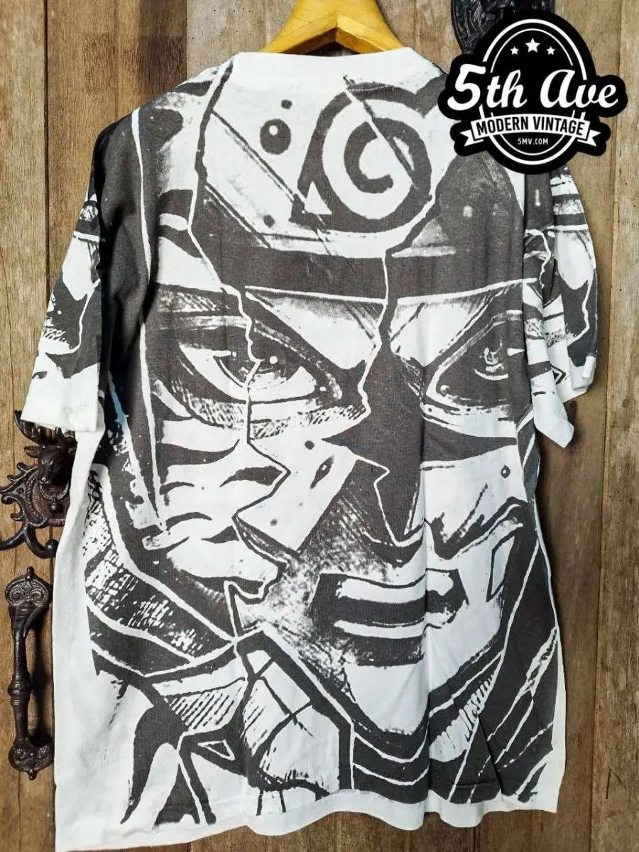 Naruto Shippuden – Split Face Hidden Leaf All Over Print – New Vintage Anime Tee vintage t-shirt laid on bed
