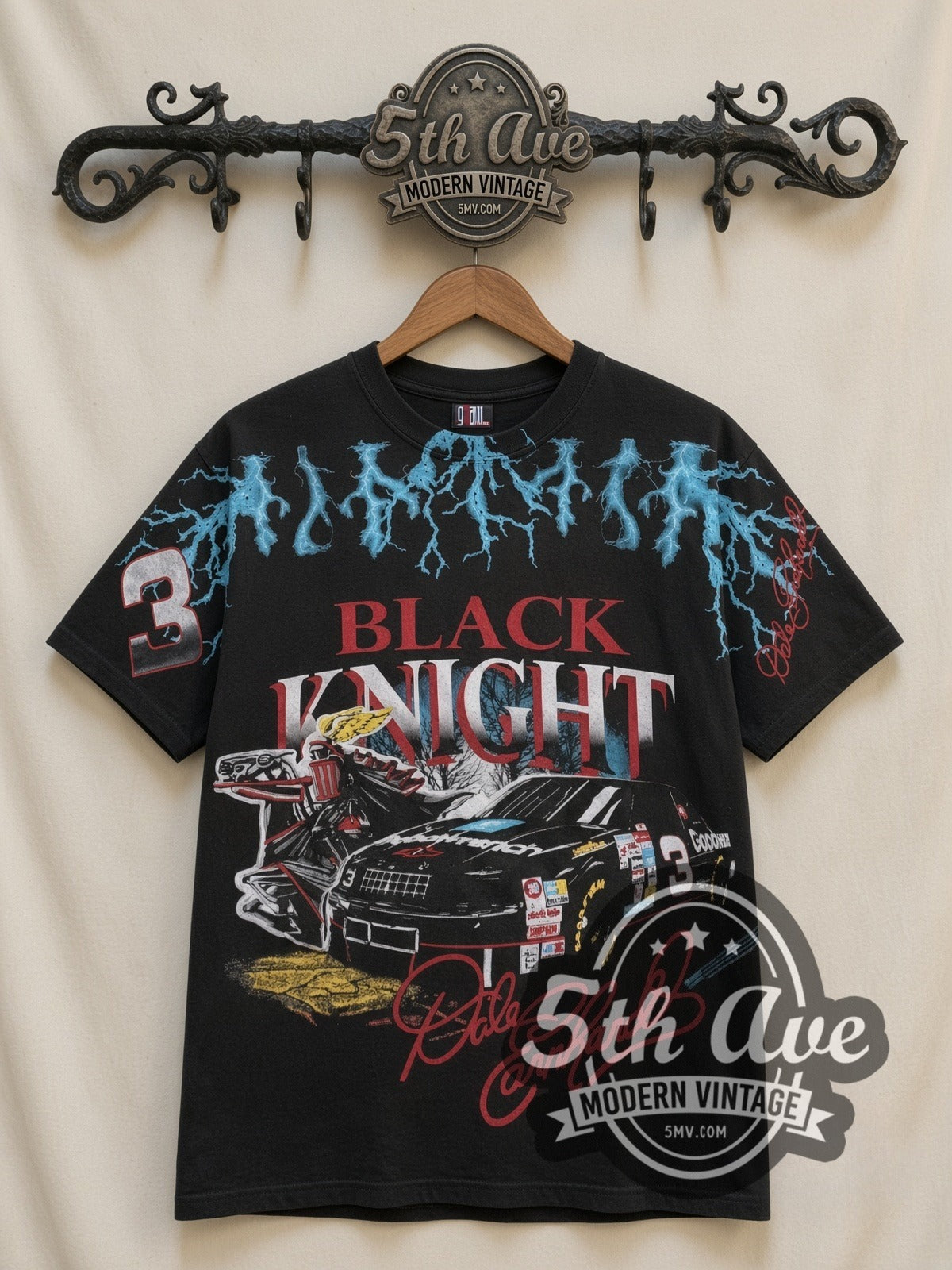 NASCAR Dale Earnhardt #3 Black Knight Lightning all-over-print vintage NASCAR t-shirt in black, front view on a display rack