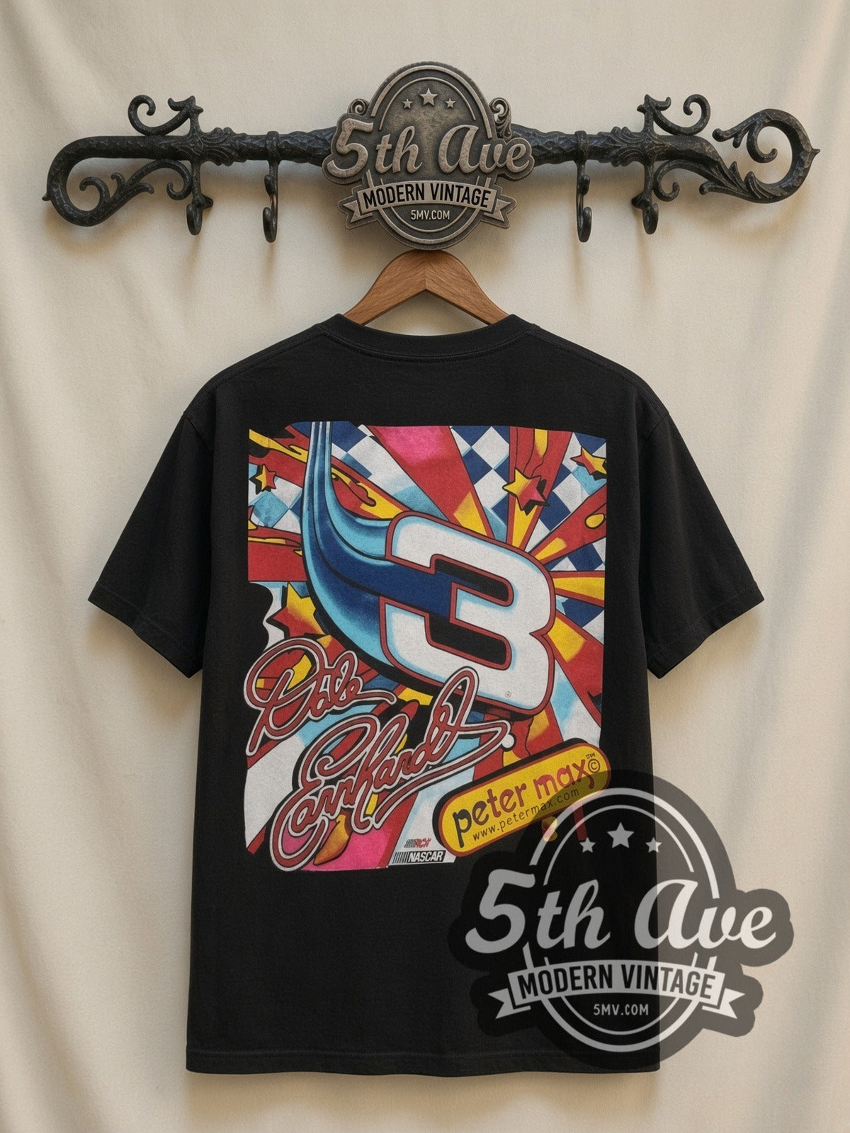 NASCAR Dale Earnhardt #3 Maximum Velocity Peter Max all-over-print vintage NASCAR t-shirt, back view on a display rack