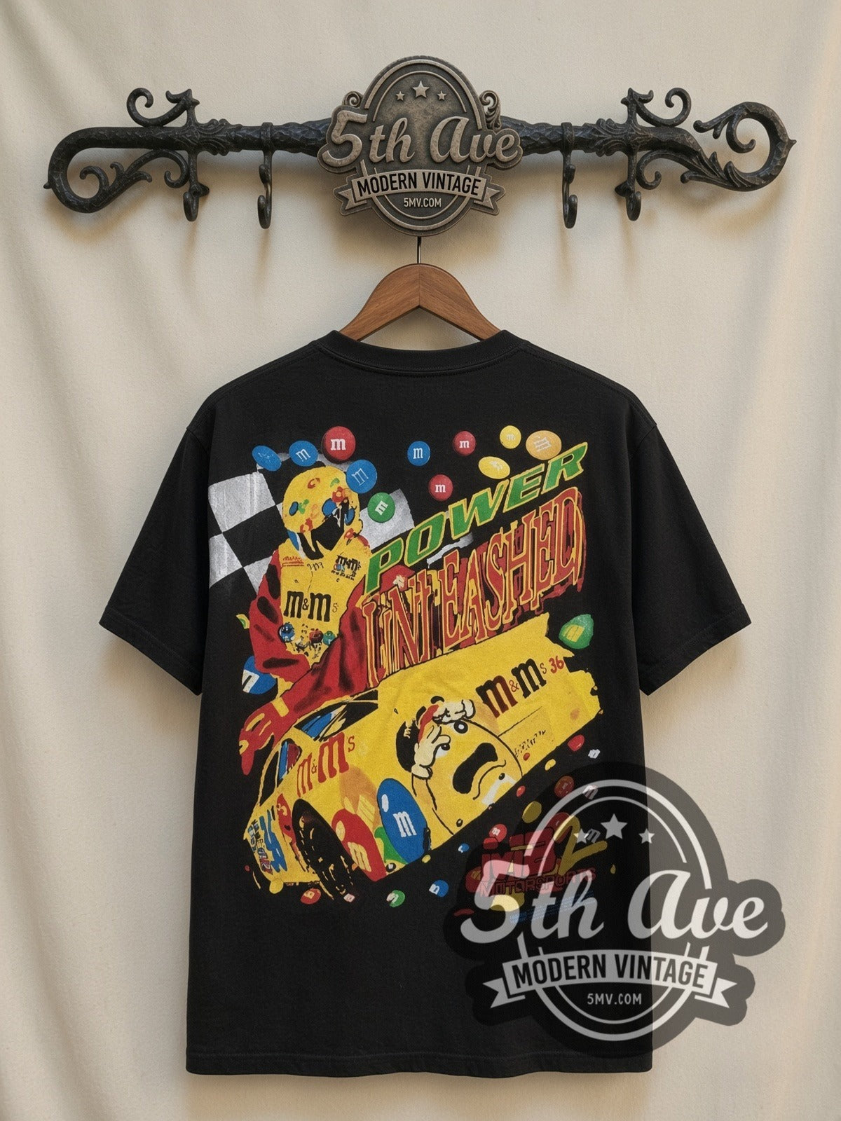 NASCAR Ernie Irvan #36 M&M's Angled Car all-over-print vintage NASCAR t-shirt in black, back view on a display rack