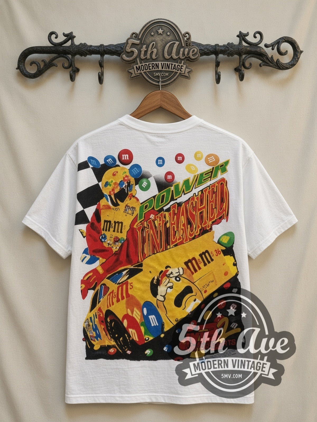 NASCAR Ernie Irvan #36 M&M's Angled Car all-over-print vintage NASCAR t-shirt in white, back view on a display rack