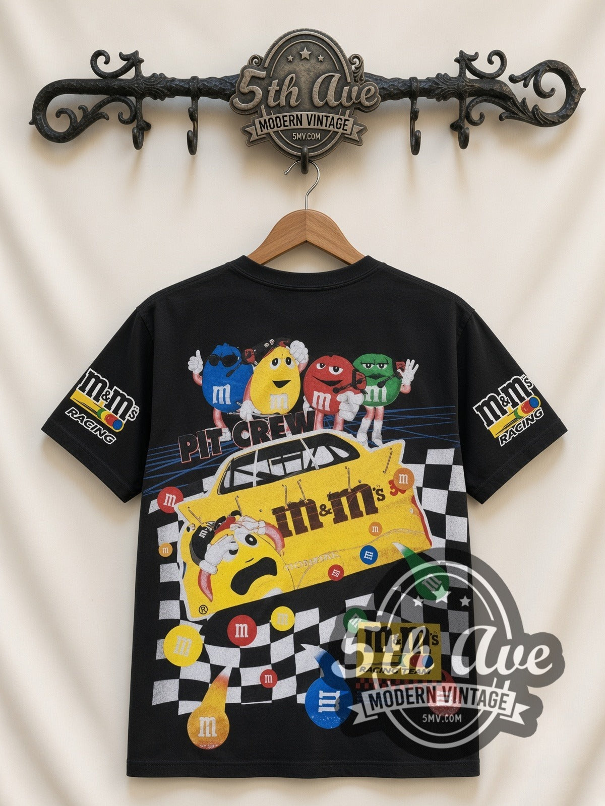 NASCAR Ernie Irvan #36 M&M's Racing all-over-print vintage NASCAR t-shirt in black, back view on a display rack