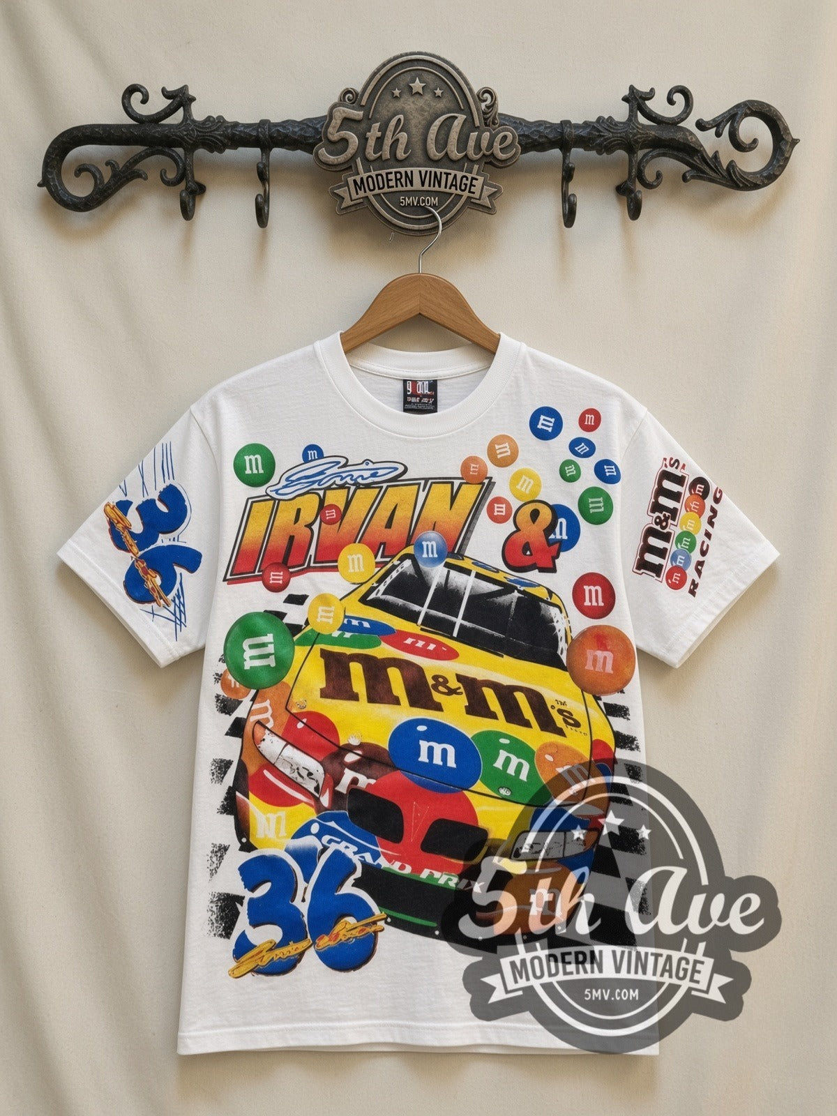 NASCAR Ernie Irvan #36 M&M's Racing all-over-print vintage NASCAR t-shirt in white, front view on a display rack