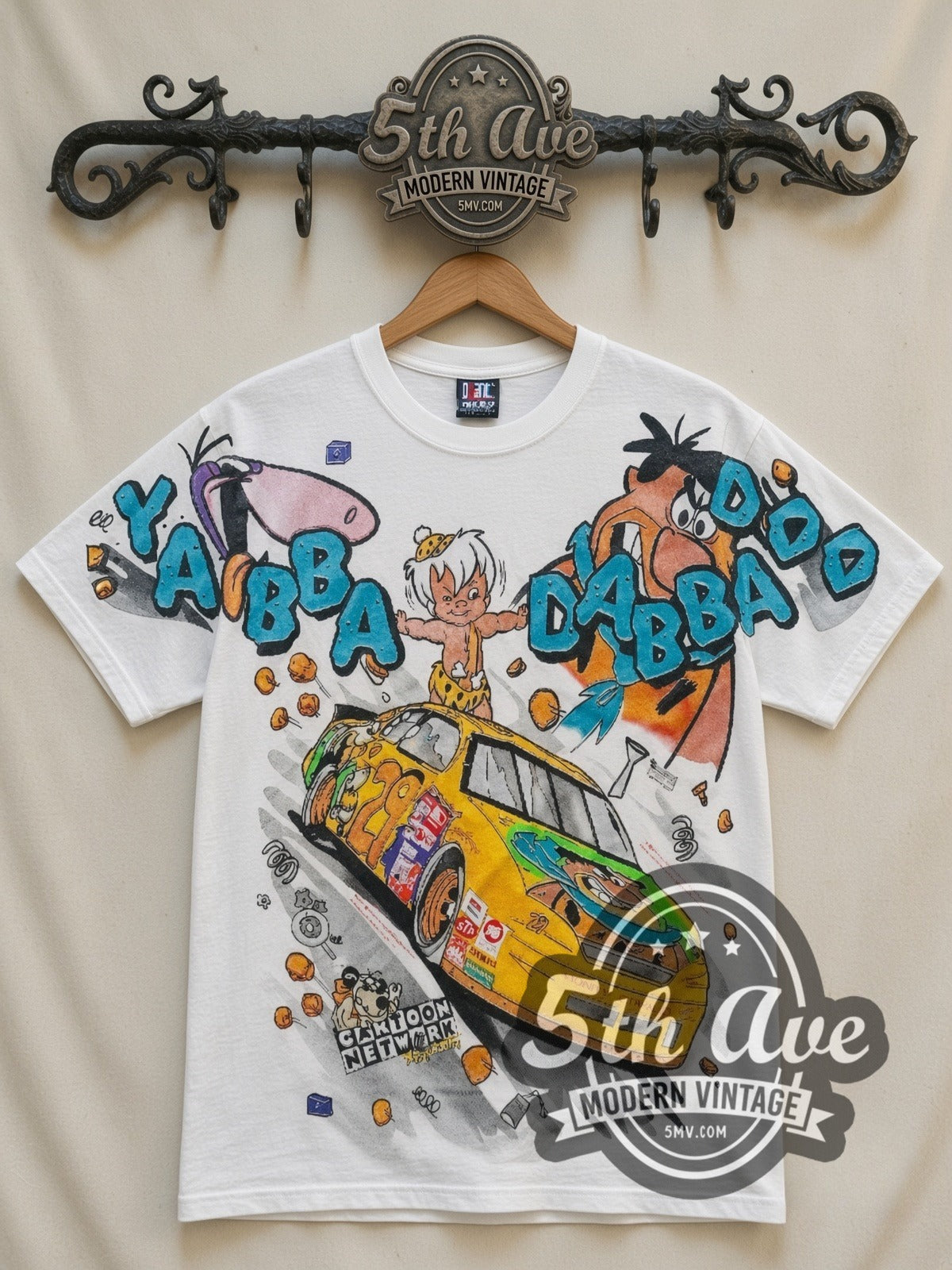 NASCAR Flintstones Yabba Dabba Doo Racing all-over-print vintage NASCAR t-shirt in white, front view on a display rack
