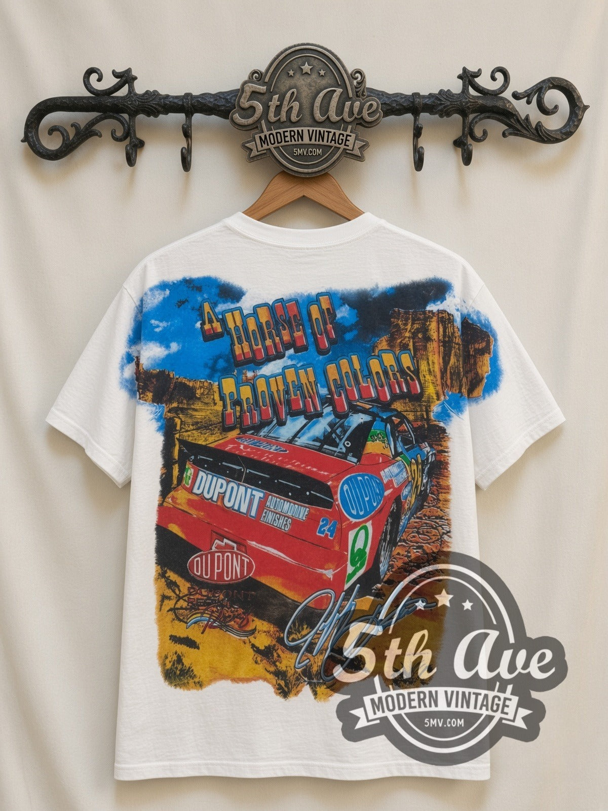 NASCAR Jeff Gordon #24 How The West Was Won all-over-print vintage NASCAR t-shirt in white, back view on a display rack