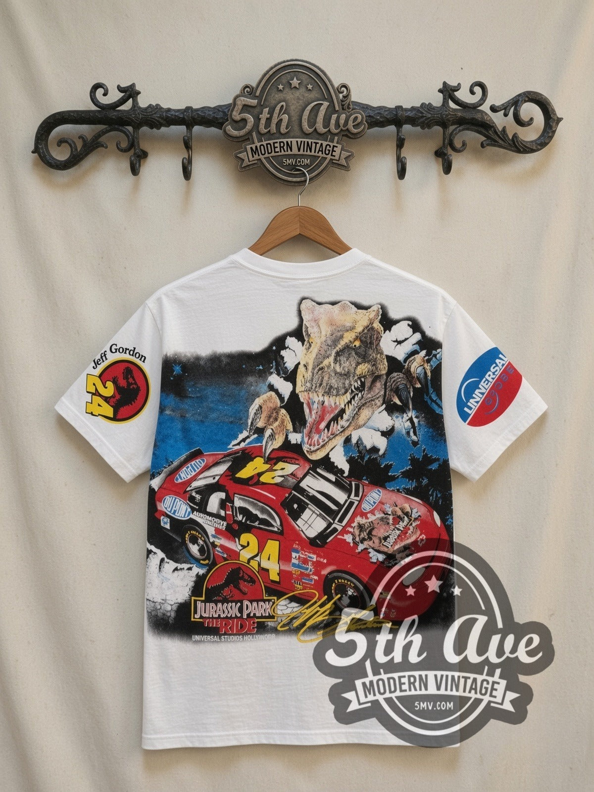 NASCAR Jeff Gordon #24 Jurassic Park The Ride all-over-print vintage NASCAR t-shirt in white, back view on a display rack